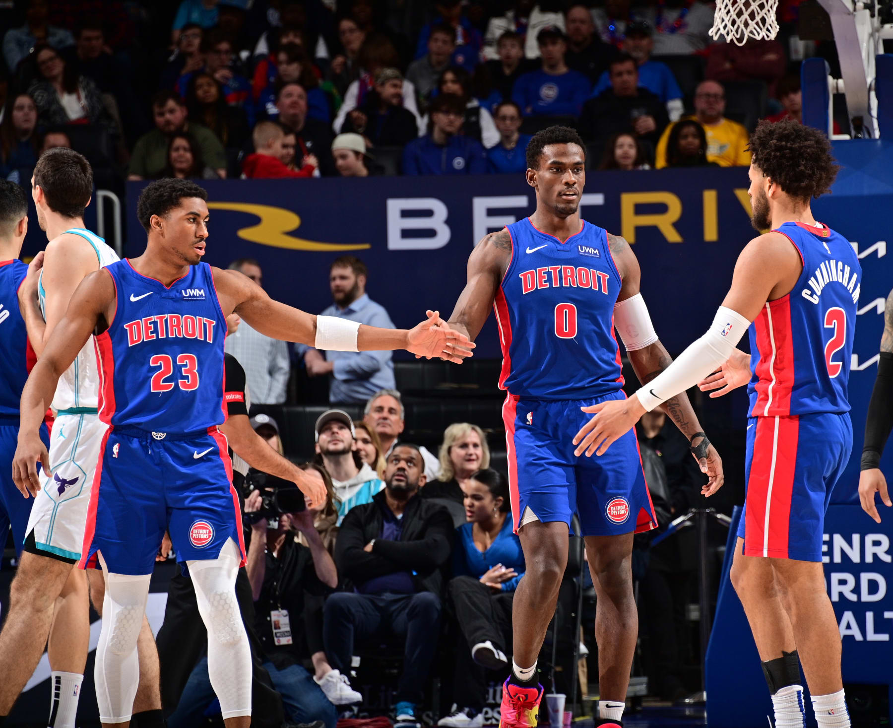 Jaden Ivey, Jalen Duren and Cade Cunningham