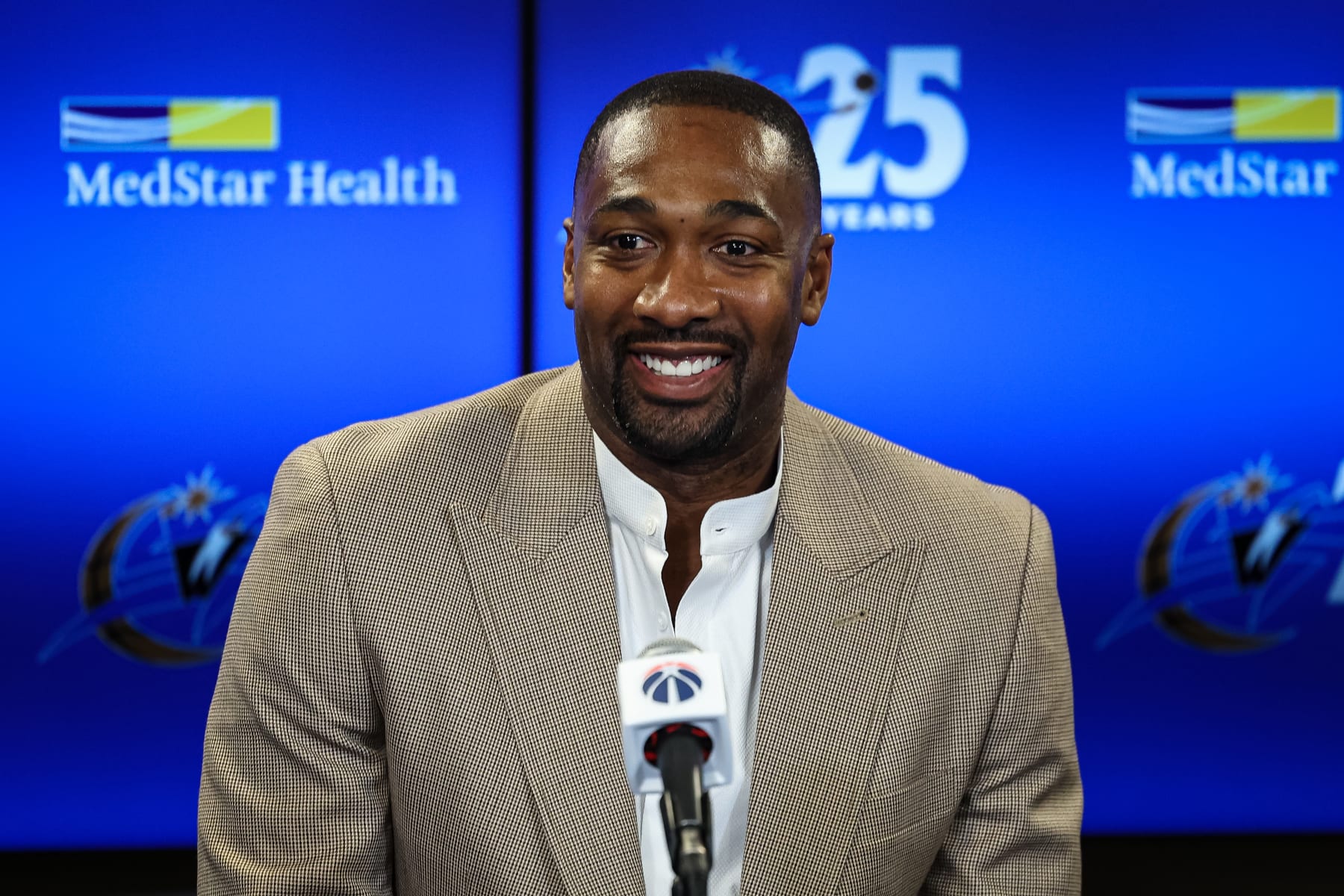 WASHINGTON, DC - NOVEMBER 18: Former Washington Wizards player Gilbert Arenas addresses the media before the game between the Washington Wizards and the Miami Heat at Capital One Arena on November 18, 2022 in Washington, DC. Gilbert Arenas, Caron Butler, and Antawn Jamison were recognized during a halftime celebration for their contributions to the franchise. NOTE TO USER: User expressly acknowledges and agrees that, by downloading and or using this photograph, User is consenting to the terms and conditions of the Getty Images License Agreement. (Photo by Scott Taetsch/Getty Images)