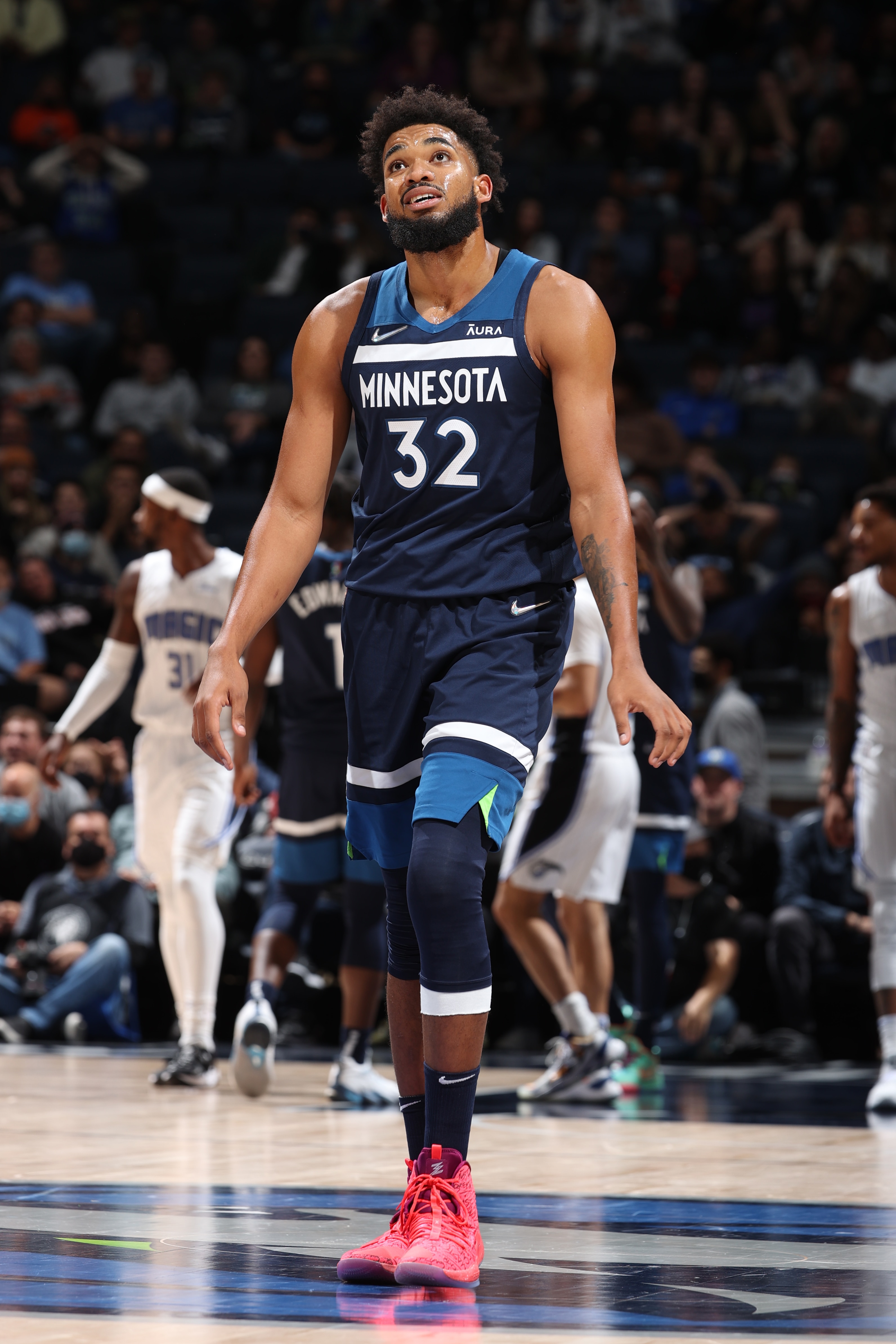 MINNEAPOLIS, MN -  NOVEMBER 1: Karl-Anthony Towns #32 of the Minnesota Timberwolves looks on during the game against the Orlando Magic on November 1, 2021 at Target Center in Minneapolis, Minnesota. NOTE TO USER: User expressly acknowledges and agrees that, by downloading and or using this Photograph, user is consenting to the terms and conditions of the Getty Images License Agreement. Mandatory Copyright Notice: Copyright 2021 NBAE (Photo by David Sherman/NBAE via Getty Images)