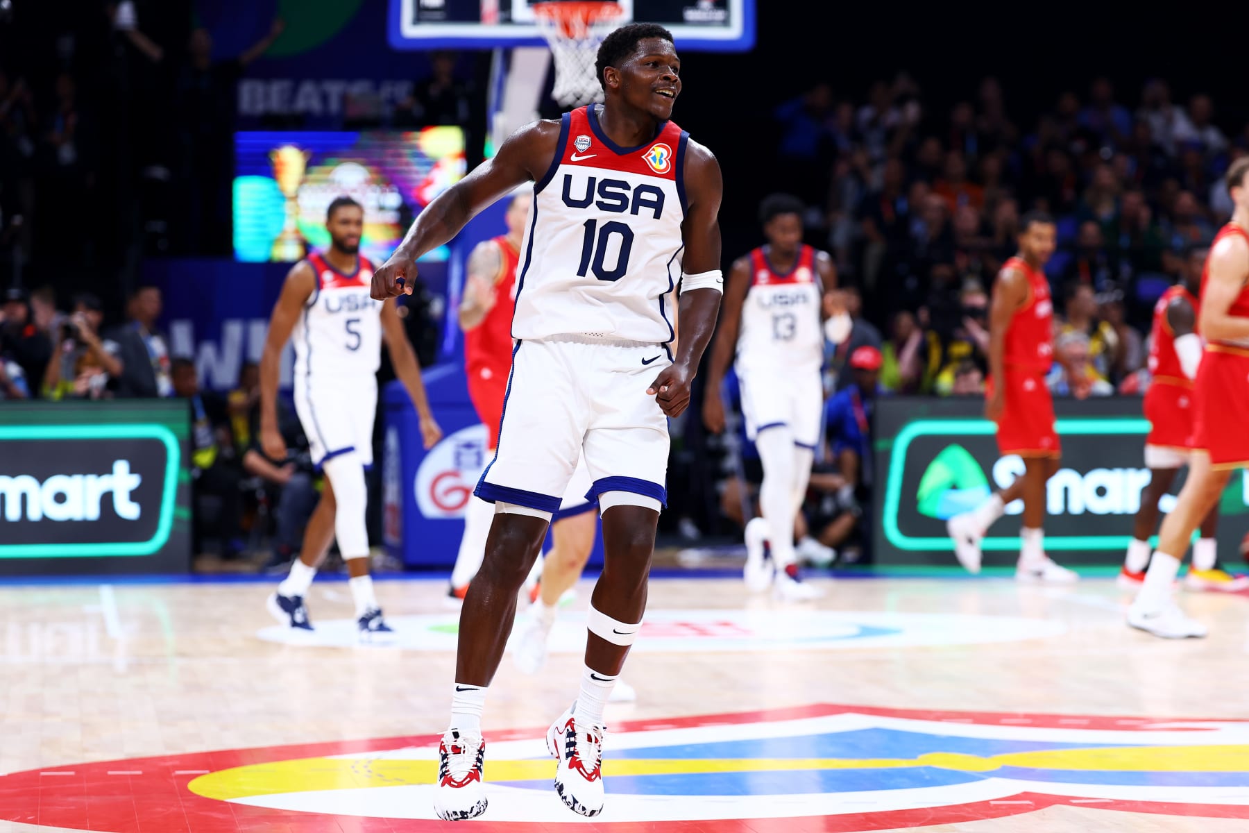 MANILA, PHILIPPINES - SEPTEMBER 08: Anthony Edwards #10 of the United States celebrates after scoring a three-pointer to force a timeout in the fourth quarter during the FIBA Basketball World Cup semifinal game against Germany at Mall of Asia Arena on September 08, 2023 in Manila, Philippines. (Photo by Yong Teck Lim/Getty Images)