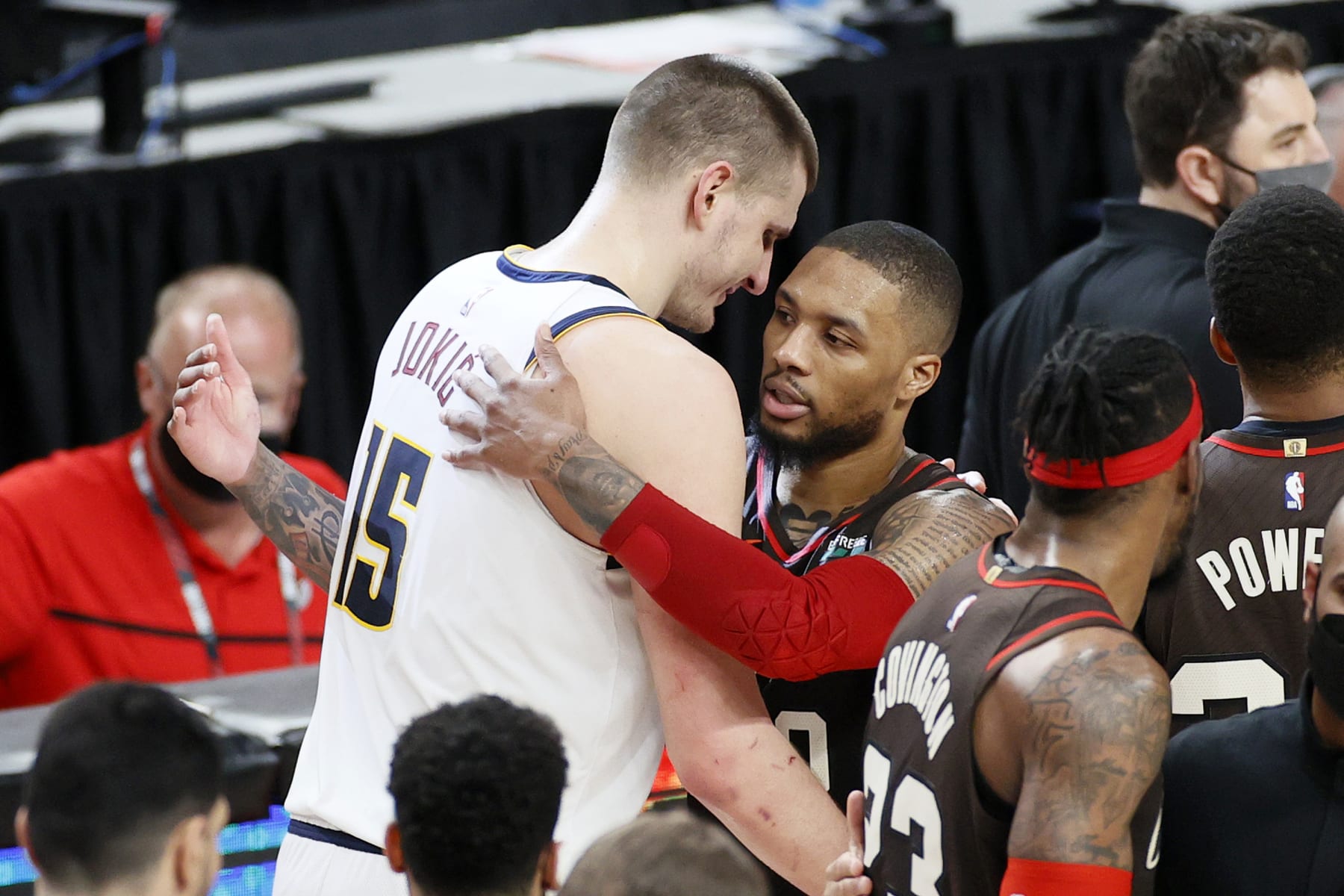 PORTLAND, OREGON - JUNE 03: Nikola Jokic #15 of the Denver Nuggets and Damian Lillard #0 of the Portland Trail Blazers shake hands after the Denver Nuggets beat the Portland Trail Blazers 126-115  Round 1, Game 6 of the 2021 NBA Playoffs at Moda Center on June 03, 2021 in Portland, Oregon. NOTE TO USER: User expressly acknowledges and agrees that, by downloading and or using this photograph, User is consenting to the terms and conditions of the Getty Images License Agreement. (Photo by Steph Chambers/Getty Images)