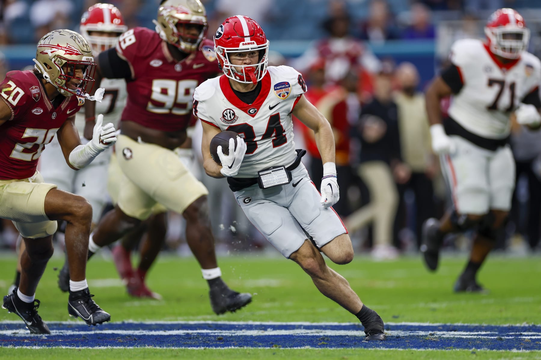 MIAMI GARDENS, FL - DECEMBER 30: Georgia Bulldogs wide receiver Ladd McConkey (84) runs with the ball for a touchdown during the game between the Georgia Bulldogs and the Florida State Seminoles on December 30, 2023 at Hard Rock Stadium in Miami Gardens, Fl.  (Photo by David Rosenblum/Icon Sportswire via Getty Images)