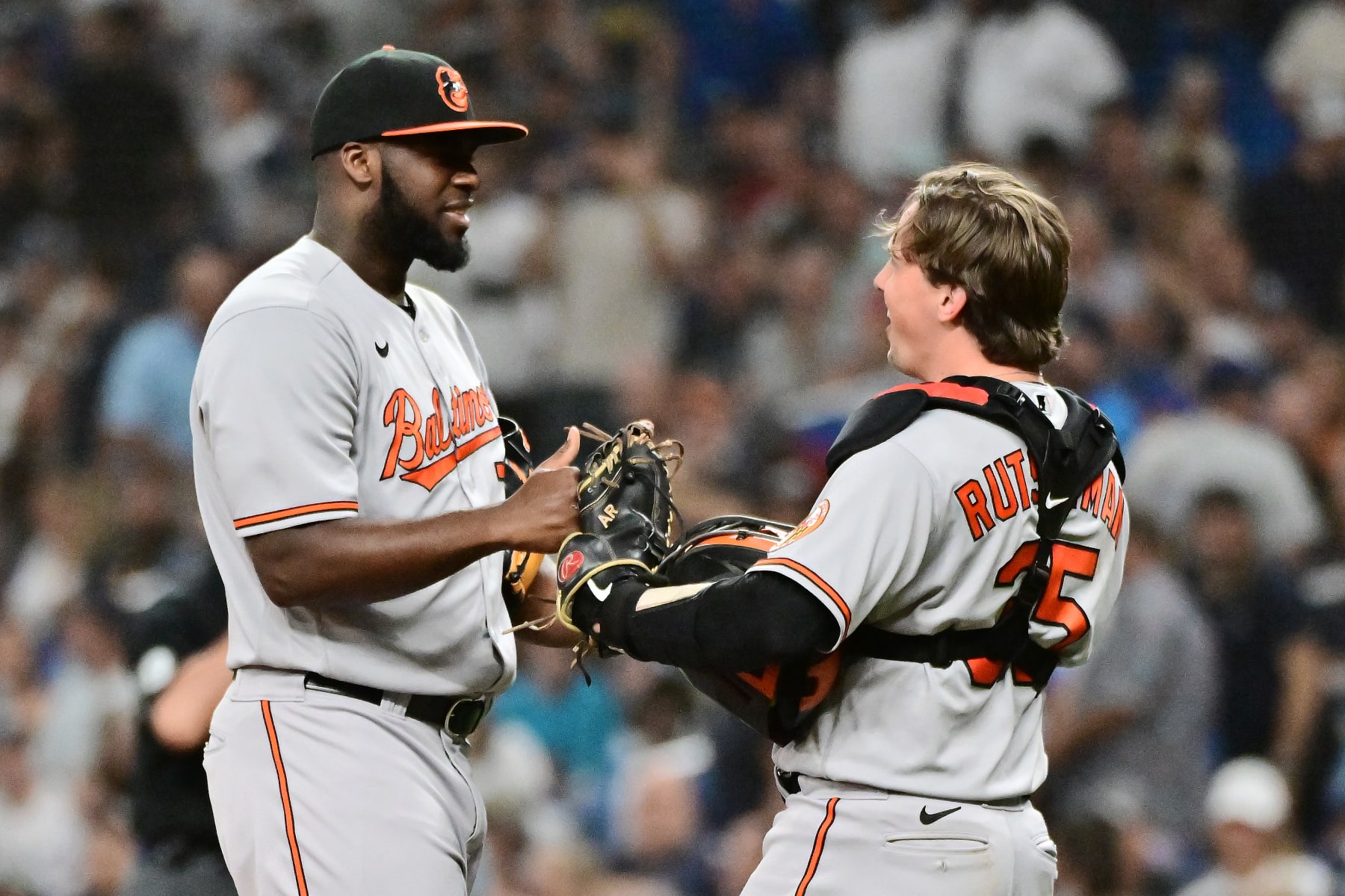 ST PETERSBURG, FLORIDA - JULY 20: Felix Bautista #74 and Adley Rutschman #35 of the Baltimore Orioles celebrate after defeating the Tampa Bay Rays 4-3 at Tropicana Field on July 20, 2023 in St Petersburg, Florida. (Photo by Julio Aguilar/Getty Images)