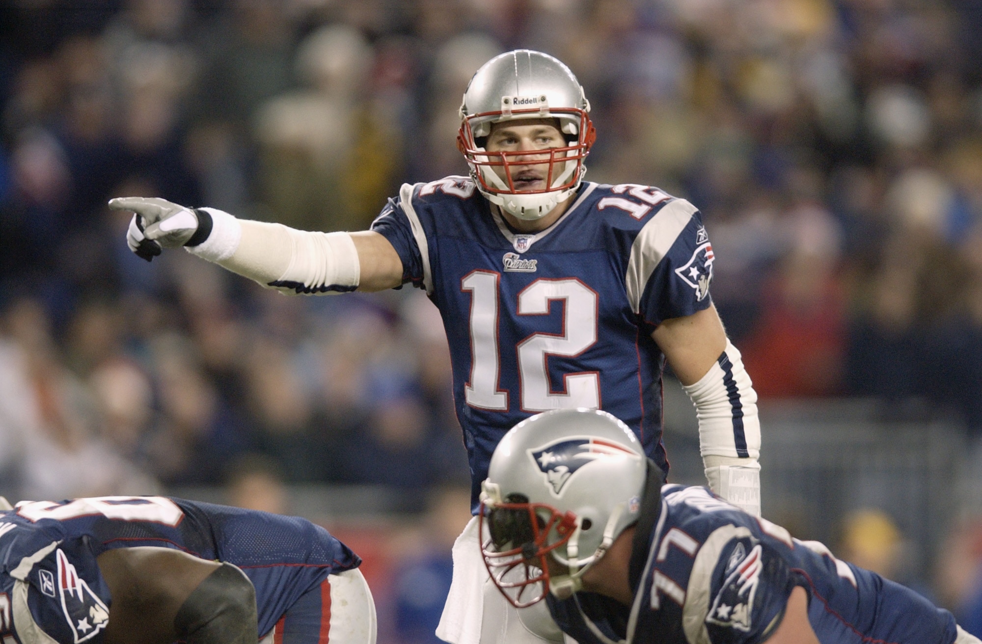 FOXBORO, MA - DECEMBER 22:  Quarterback Tom Brady #12 of the New England Patriots points during the NFL game against the New York Jets at Gillette Stadium on December 22, 2002 in Foxboro, Massachusetts. The Jets beat the Patriots 30-17.  (Photo by Ezra Shaw/Getty Images)