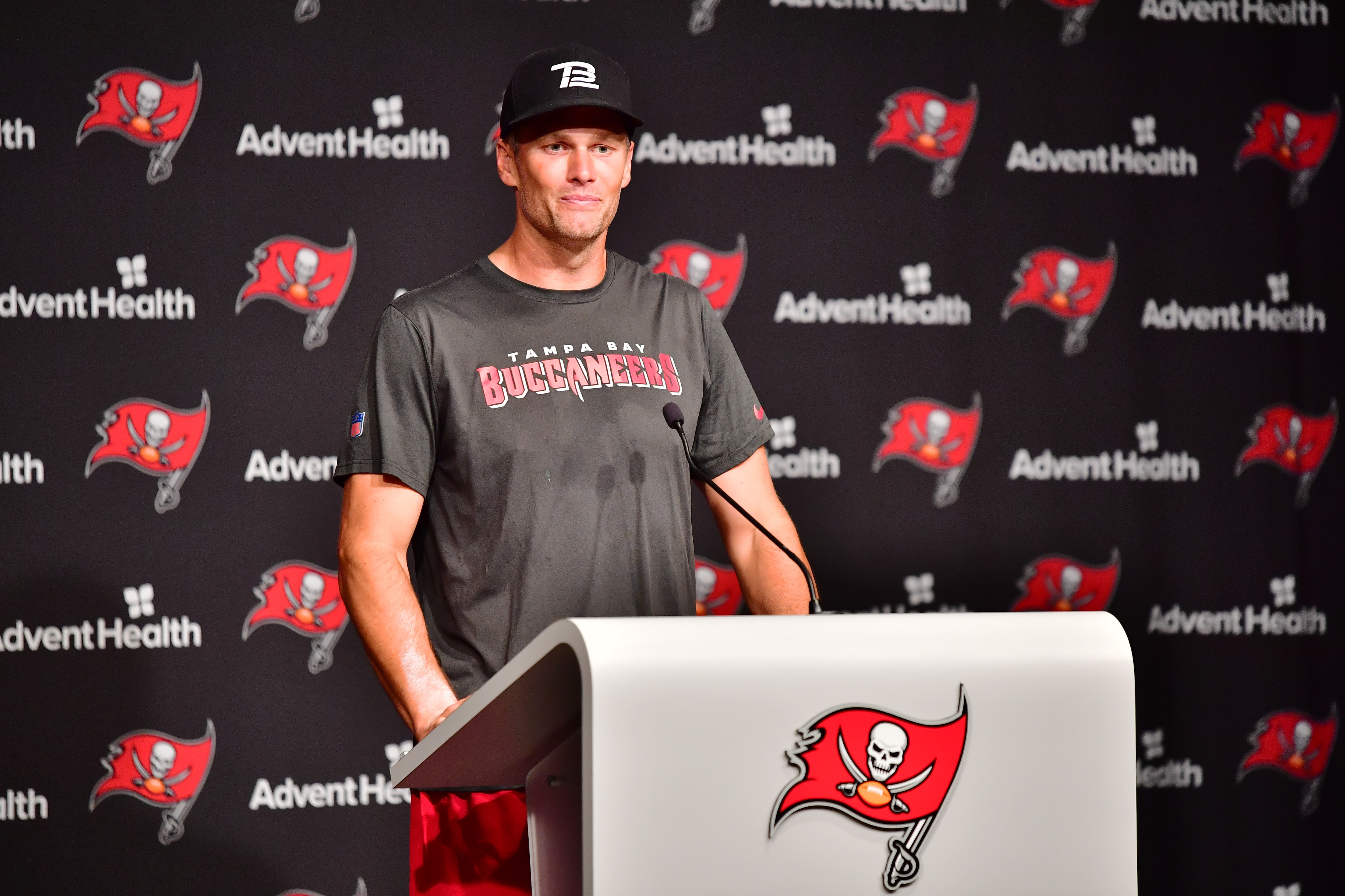 TAMPA, FLORIDA - JUNE 09: Tom Brady #12 of Tampa Bay Buccaneers answers questions at a press conference following the 2022 Buccaneers minicamp at AdventHealth Training Center on June 09, 2022 in Tampa, Florida. (Photo by Julio Aguilar/Getty Images)