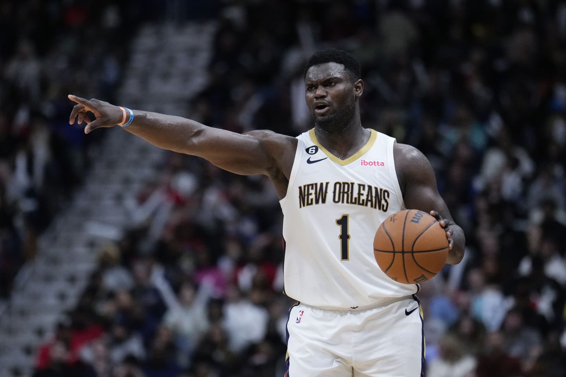 New Orleans Pelicans forward Zion Williamson (1) moves the ball down court in the second half of an NBA basketball game against the Milwaukee Bucks in New Orleans, Monday, Dec. 19, 2022. The Bucks won 128-119. (AP Photo/Gerald Herbert)