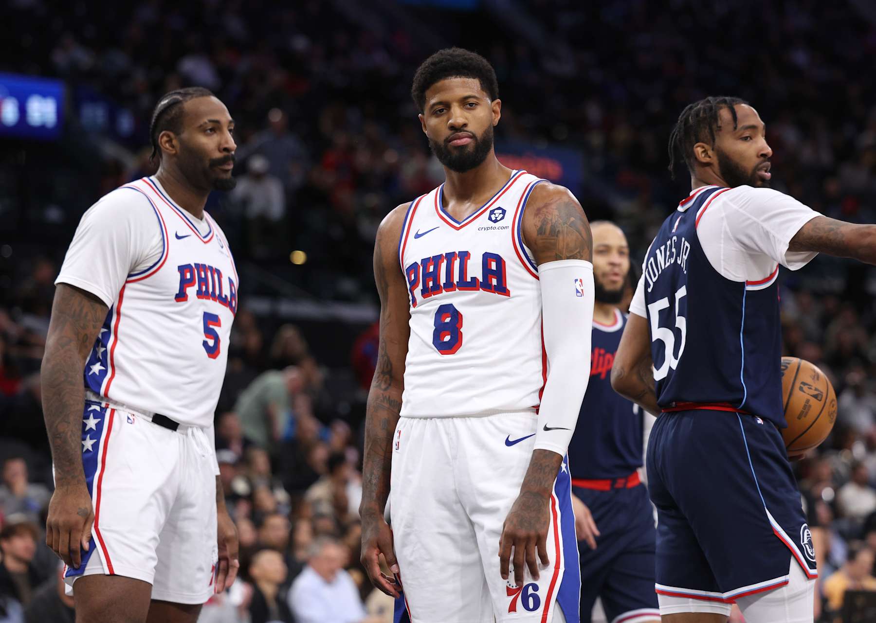 INGLEWOOD, CALIFORNIA - NOVEMBER 06: Paul George #8 of the Philadelphia 76ers reacts to his foul with Andre Drummond #5 behind Derrick Jones Jr. #55 of the LA Clippers during a 110-98 Clippers win at Intuit Dome on November 06, 2024 in Inglewood, California. (Photo by Harry How/Getty Images) NOTE TO USER: User expressly acknowledges and agrees that, by downloading and/or using this Photograph, user is consenting to the terms and conditions of the Getty Images License Agreement.  (Photo by Harry How/Getty Images)