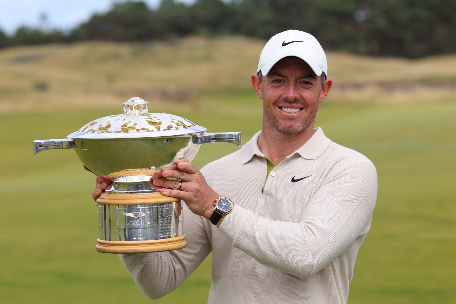 NORTH BERWICK, SCOTLAND - JULY 16: Rory McIlroy of Northern Ireland poses for a photo with the Genesis Scottish Open trophy on the 18th green after winning the tournament during Day Four of the Genesis Scottish Open at The Renaissance Club on July 16, 2023 in United Kingdom. (Photo by Andrew Redington/Getty Images)
