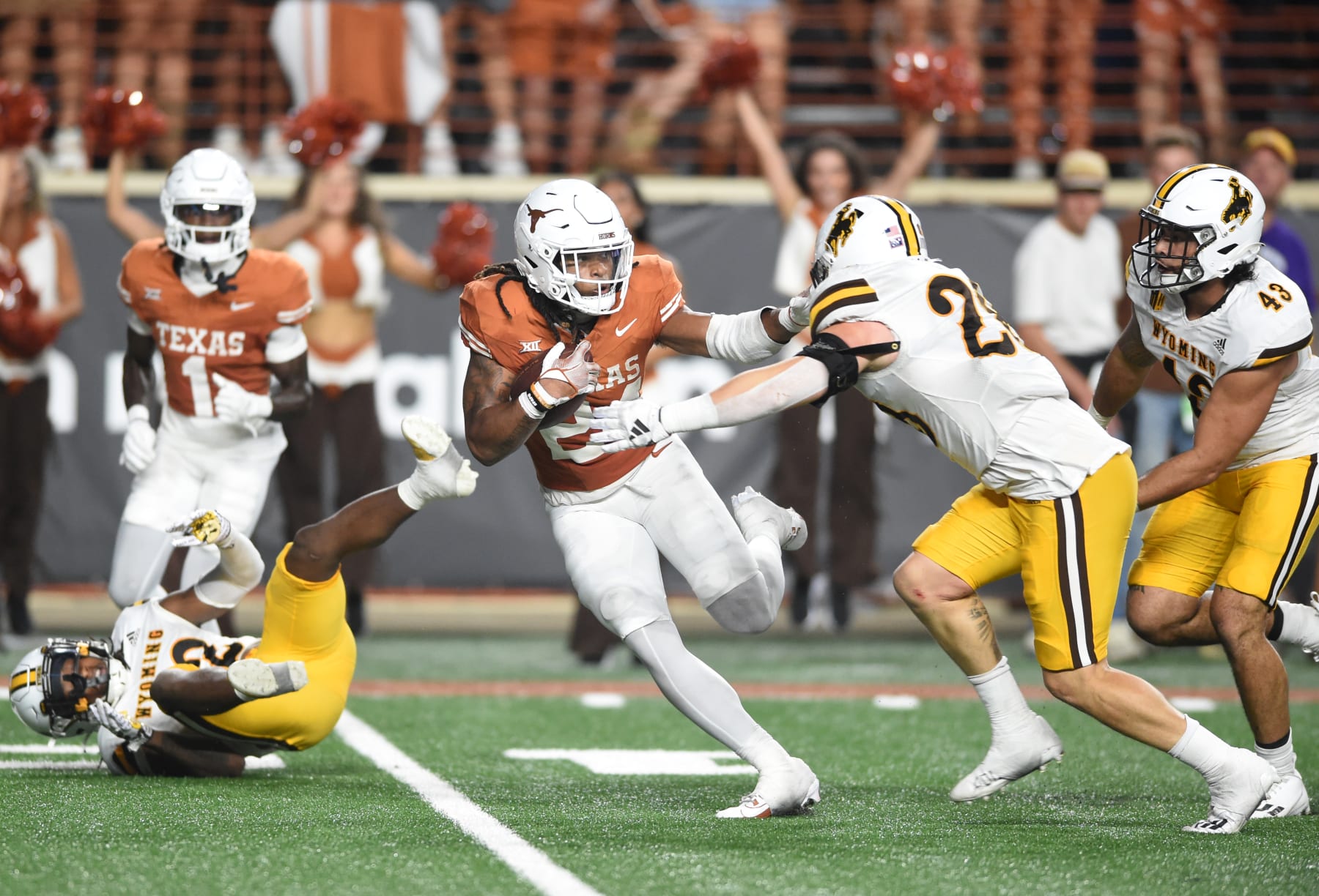 AUSTIN, TX - SEPTEMBER 16: Texas Longhorns RB Jonathan Brooks (24) runs from Wyoming Cowboys LB Easton Gibbs (right) during the college football game between Texas Longhorns and Wyoming Cowboys on September 16, 2023, at Darrell K Royal-Texas Memorial Stadium in Austin, TX. (Photo by John Rivera/Icon Sportswire via Getty Images)