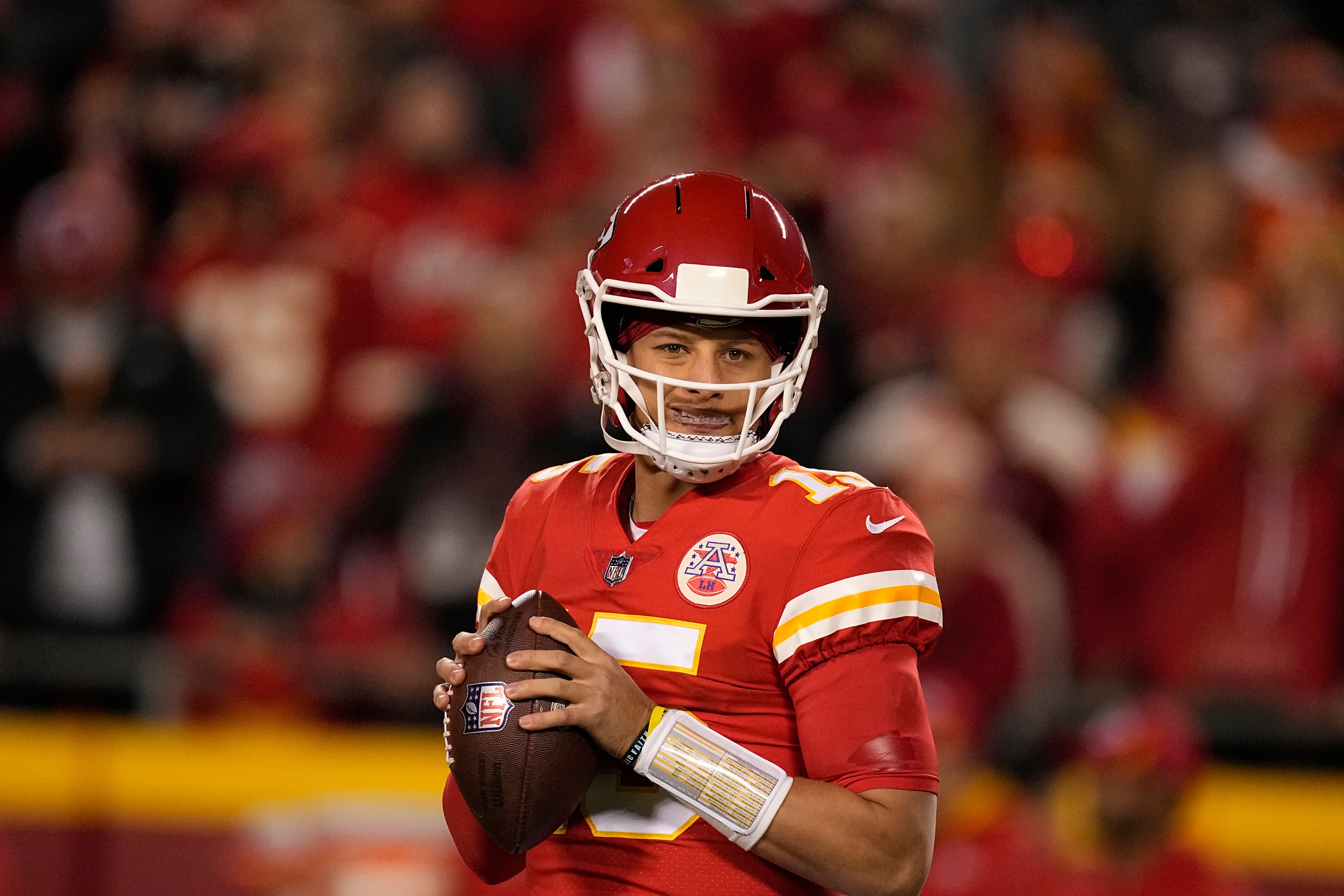 Kansas City Chiefs quarterback Patrick Mahomes warms up before the start of an NFL football game between the Denver Broncos and Kansas City Chiefs Sunday, Dec. 5, 2021, in Kansas City, Mo. (AP Photo/Charlie Riedel)