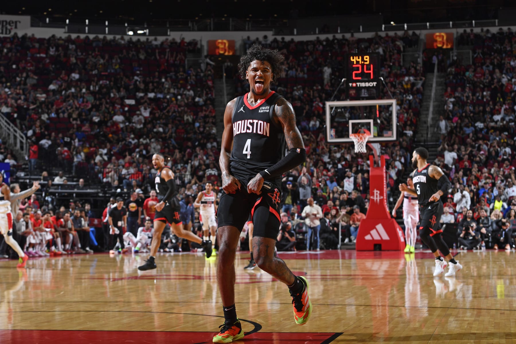 HOUSTON, TX - MARCH 14: Jalen Green #4 of the Houston Rockets celebrates during the game against the Washington Wizards on March 14, 2024 at the Toyota Center in Houston, Texas. NOTE TO USER: User expressly acknowledges and agrees that, by downloading and or using this photograph, User is consenting to the terms and conditions of the Getty Images License Agreement. Mandatory Copyright Notice: Copyright 2024 NBAE (Photo by Logan Riely/NBAE via Getty Images)