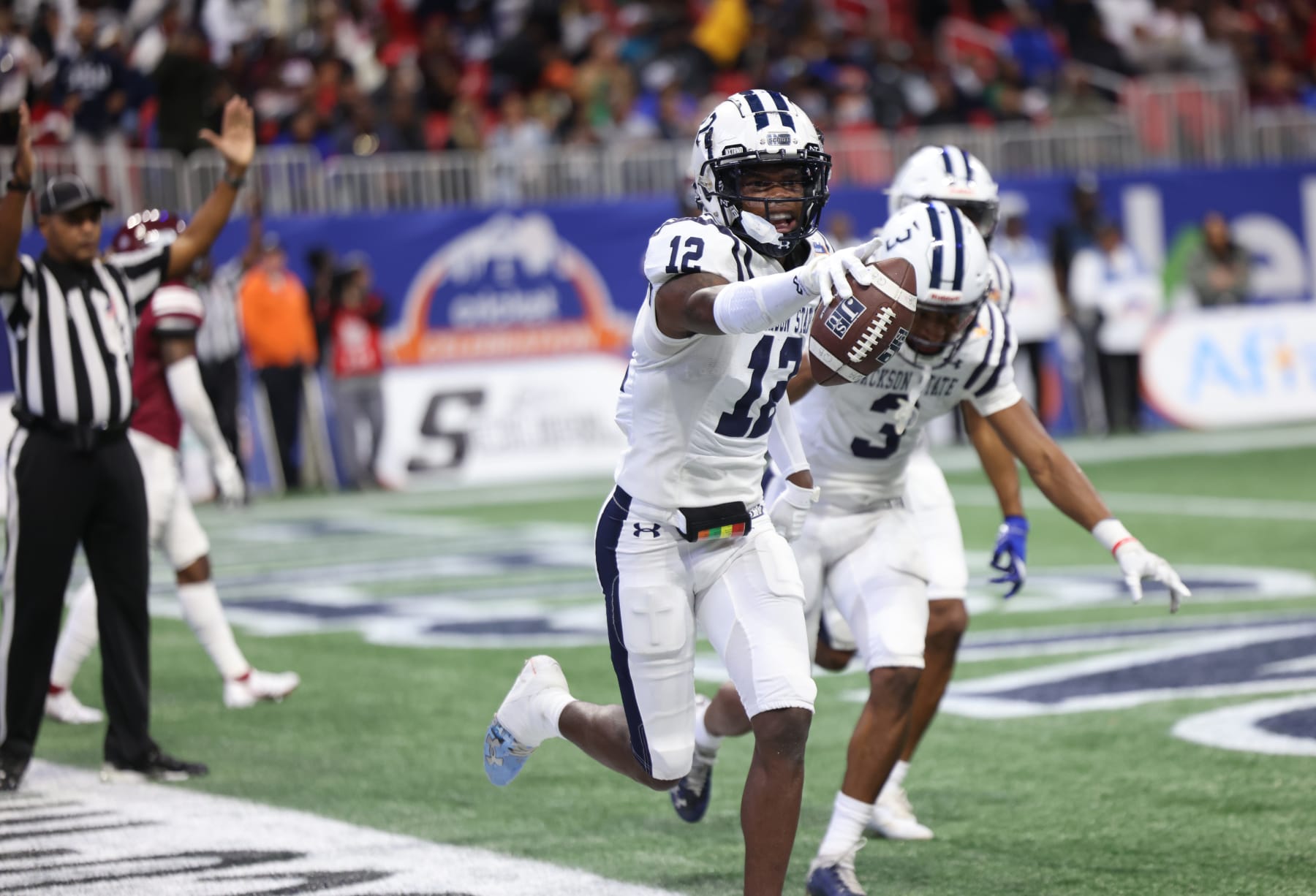 ATLANTA, GA - DECEMBER 17: JSU receiver Travis Hunter celebrates with teammates after scoring during the Jackson State Tigers and North Carolina Central Eagles Celebration Bowl Football Championship game at Mercedes Benz Stadium on December 17, 2022, in Atlanta, GA (Photo by Charles A. Smith/Jackson State University via Getty Images)