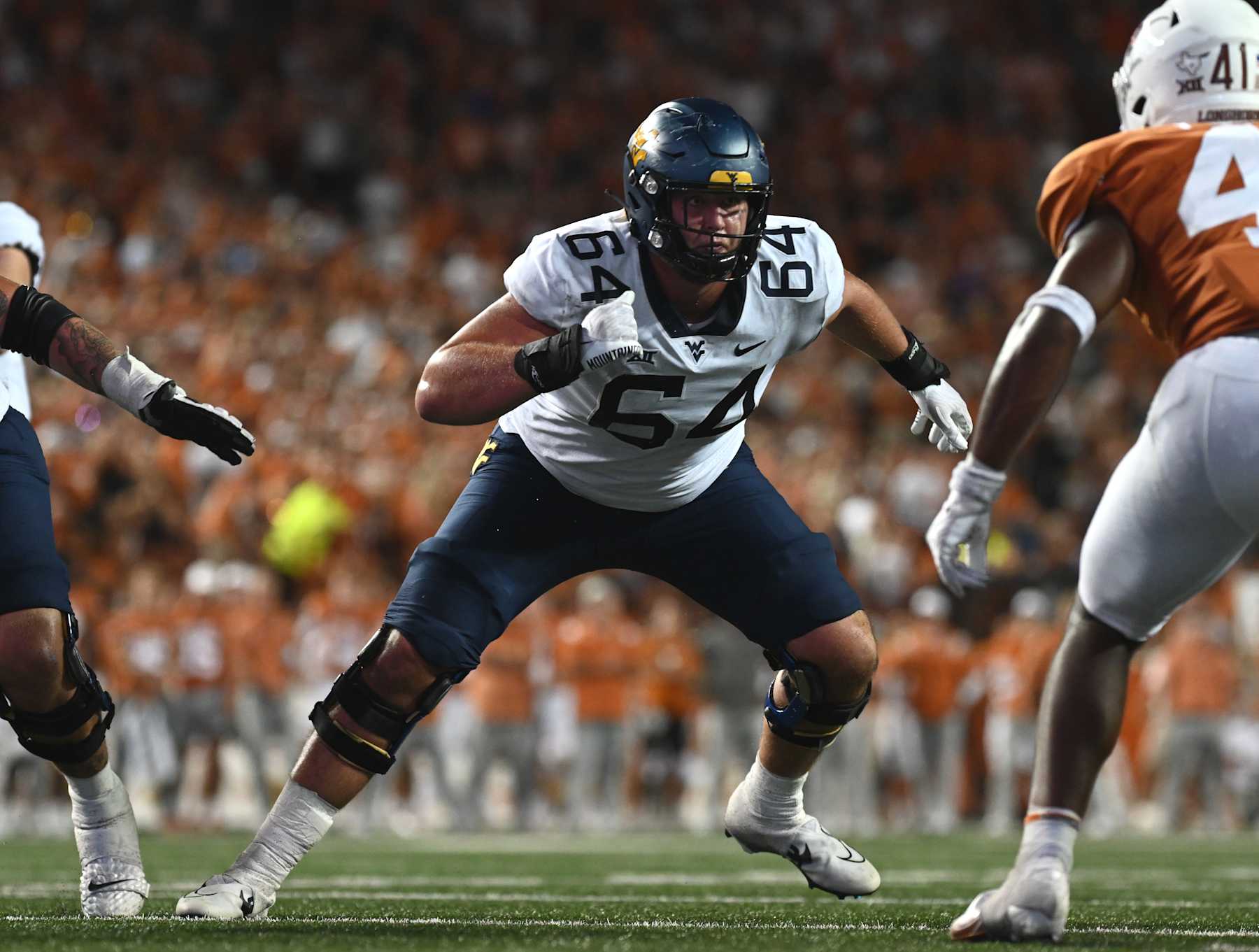 AUSTIN, TX - OCTOBER 01: West Virginia Mountaineer lineman Wyatt Milum blocks during the game between the West Virginia Mountaineers and the Texas Longhorns on October 1, 2022, at Darrell K Royal-Texas Memorial Stadium in Austin, Texas.  (Photo by John Rivera/Icon Sportswire via Getty Images)