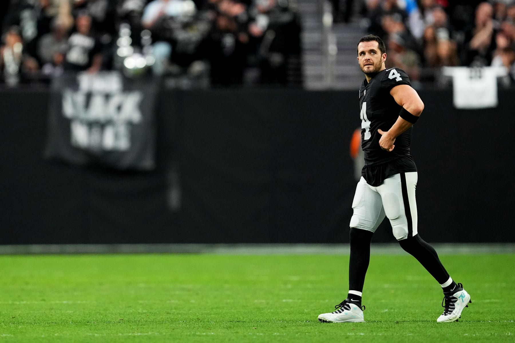 LAS VEGAS, NEVADA - DECEMBER 04: Derek Carr #4 of the Las Vegas Raiders walks onto the field after a field goal in the second quarter of a game against the Los Angeles Chargers at Allegiant Stadium on December 04, 2022 in Las Vegas, Nevada. (Photo by Chris Unger/Getty Images)