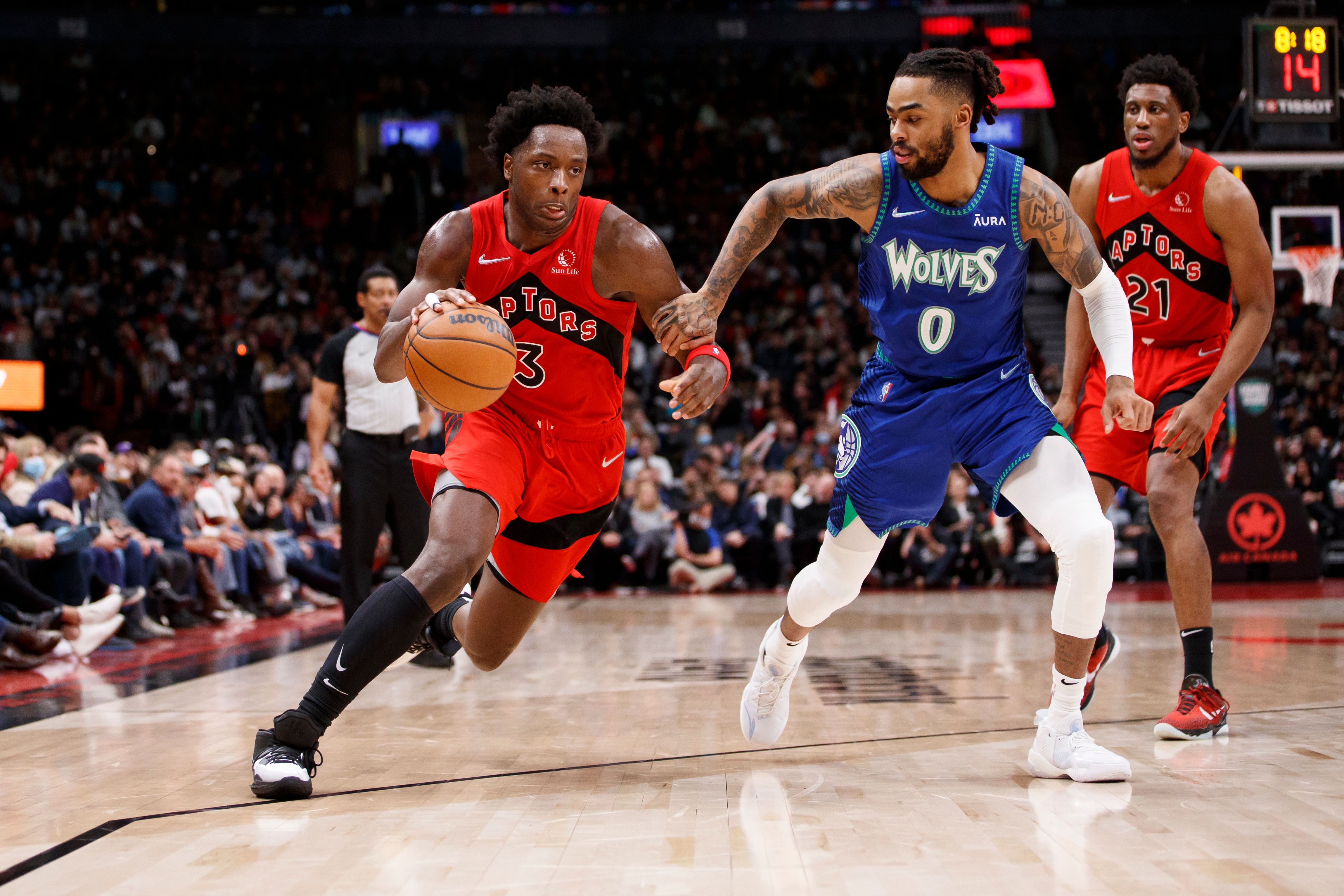 TORONTO, ON - MARCH 30: OG Anunoby #3 of the Toronto Raptors drives against D'Angelo Russell #0 of the Minnesota Timberwolves dunks during the second half of their NBA game at Scotiabank Arena on March 30, 2022 in Toronto, Canada. NOTE TO USER: User expressly acknowledges and agrees that, by downloading and or using this Photograph, user is consenting to the terms and conditions of the Getty Images License Agreement. (Photo by Cole Burston/Getty Images)