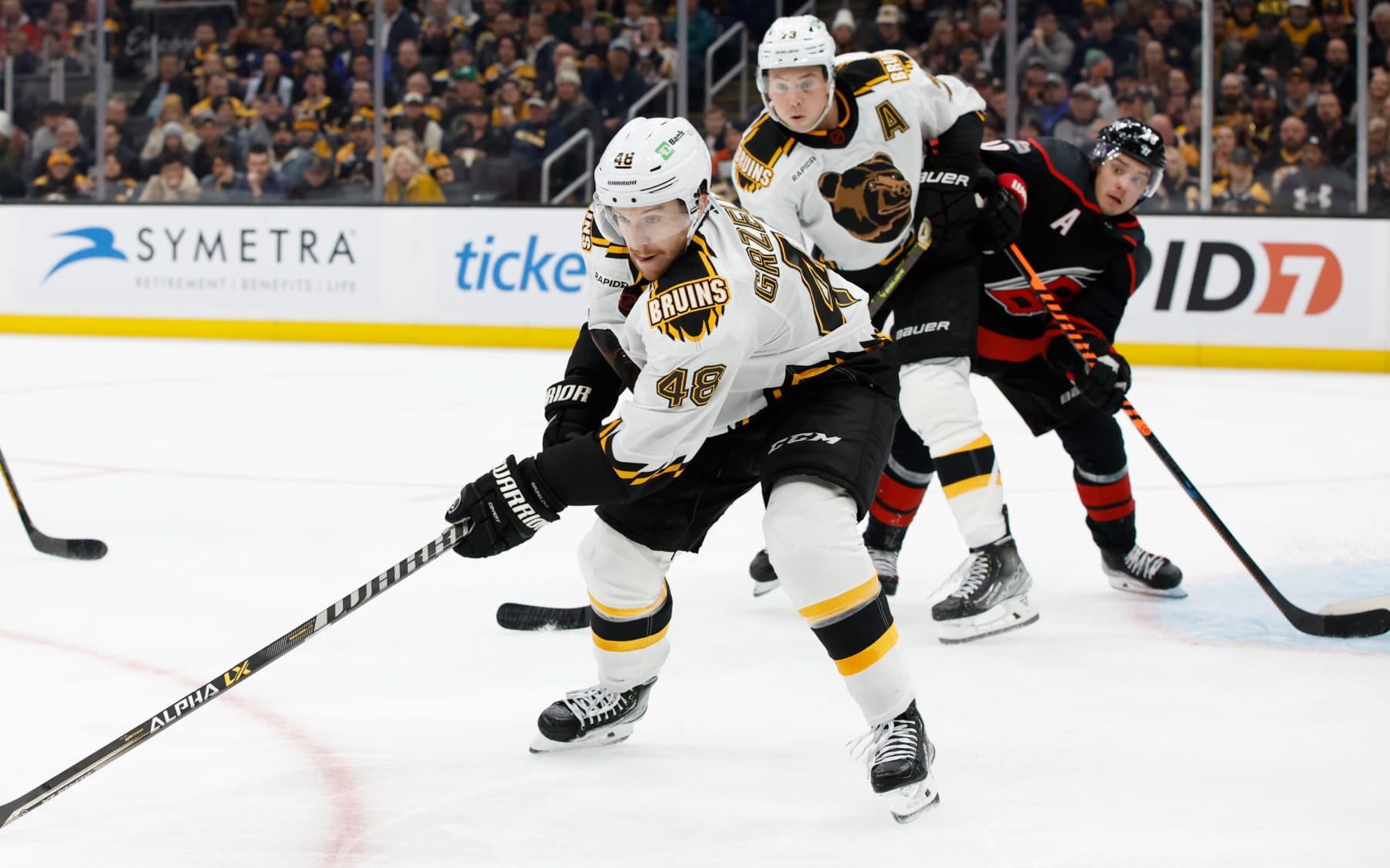 BOSTON, MA - NOVEMBER 25: Matt Grzelcyk #48 of the Boston Bruins skates against the Carolina Hurricanes during the first period at the TD Garden on November 25, 2022 in Boston, Massachusetts. The Bruins won 3-2 in overtime and set a new NHL record for most consecutive wins at home to start a season with 12. (Photo by Richard T Gagnon/Getty Images)