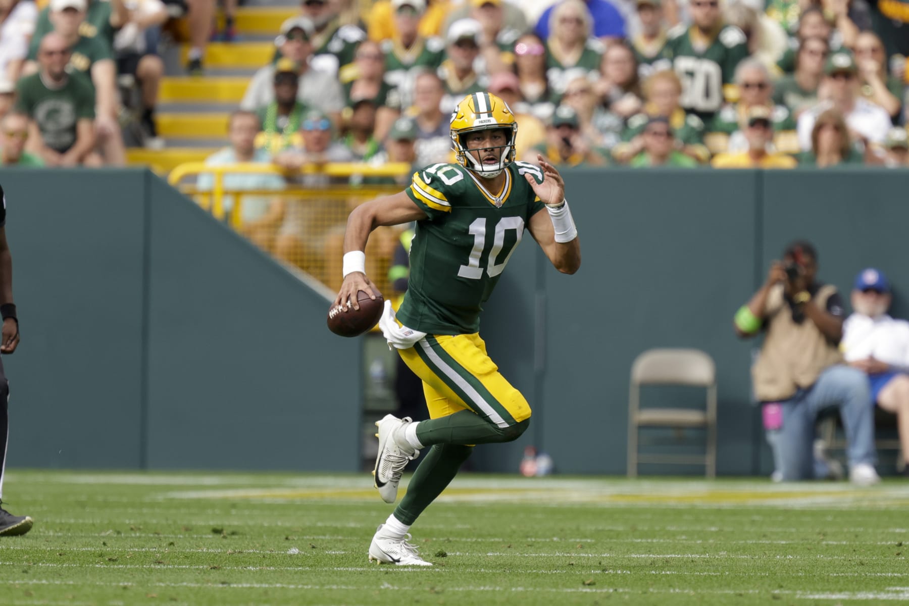 Green Bay Packers quarterback Jordan Love (10) rushes during an NFL football game between the Green Bay Packers and New Orleans Saints Sunday, Sept. 24, 2023, in Green Bay, Wis. (AP Photo/Matt Ludtke)
