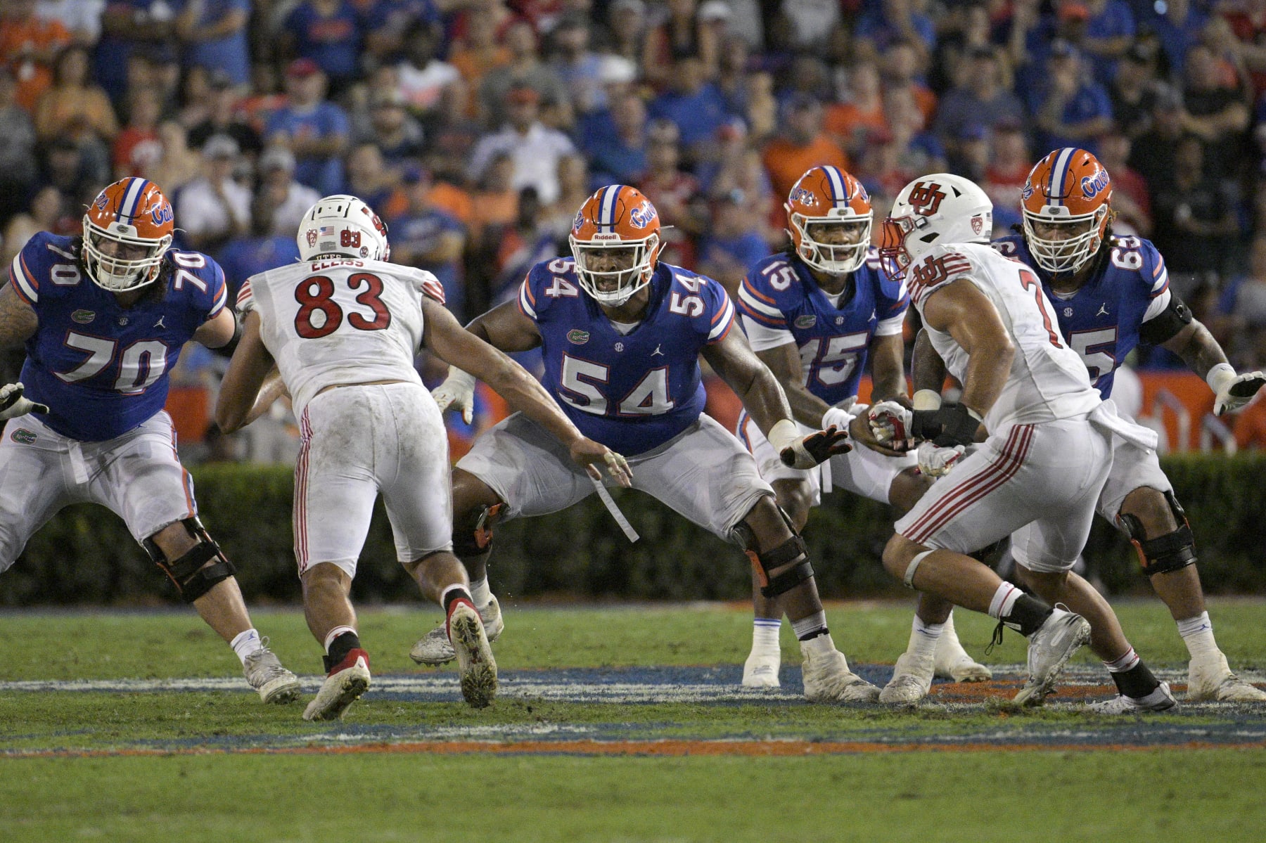 Florida offensive lineman O'Cyrus Torrence (54) sets up to block in front of Utah defensive end Jonah Elliss (83) during the second half of an NCAA college football game, Saturday, Sept. 3, 2022, in Gainesville, Fla. (AP Photo/Phelan M. Ebenhack)