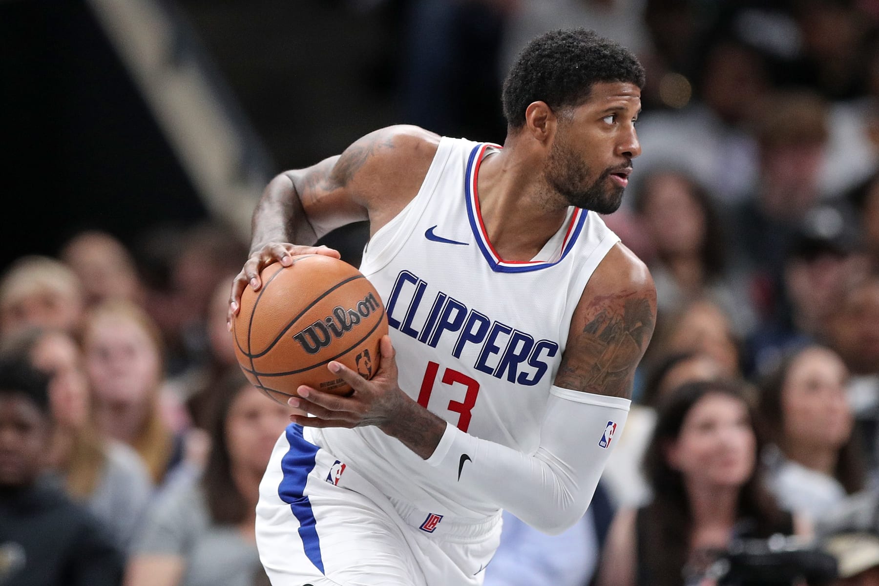 MEMPHIS, TENNESSEE - FEBRUARY 23: Paul George #13 of the Los Angeles Clippers handles the ball during the game against the Memphis Grizzlies at FedExForum on February 23, 2024 in Memphis, Tennessee. NOTE TO USER: User expressly acknowledges and agrees that, by downloading and or using this photograph, User is consenting to the terms and conditions of the Getty Images License Agreement. (Photo by Justin Ford/Getty Images)