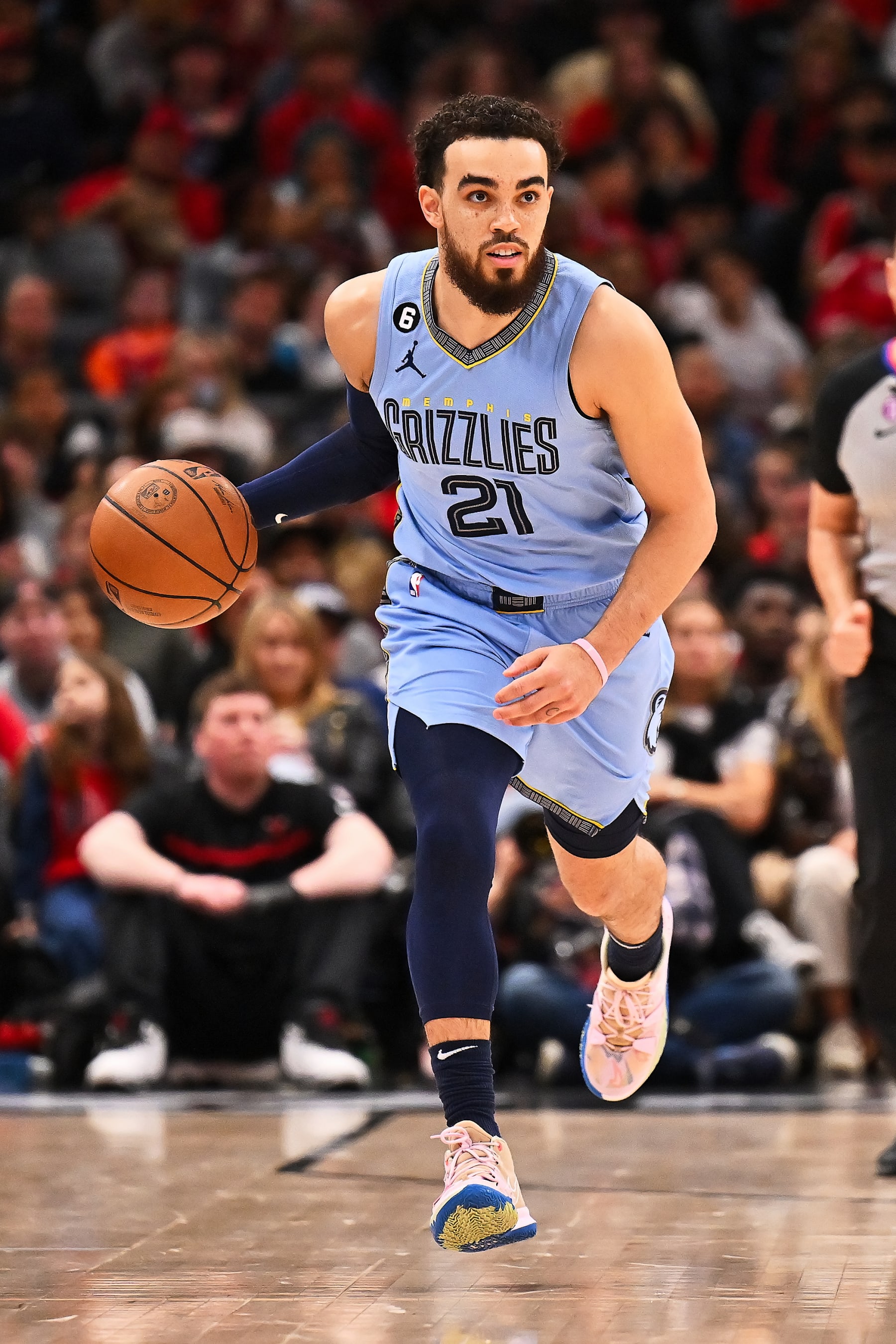 CHICAGO, ILLINOIS - APRIL 02:  Tyus Jones #21 of the Memphis Grizzlies controls the ball against the Chicago Bulls on April 02, 2023 at United Center in Chicago, Illinois.   NOTE TO USER: User expressly acknowledges and agrees that, by downloading and or using this photograph, User is consenting to the terms and conditions of the Getty Images License Agreement.  (Photo by Jamie Sabau/Getty Images)