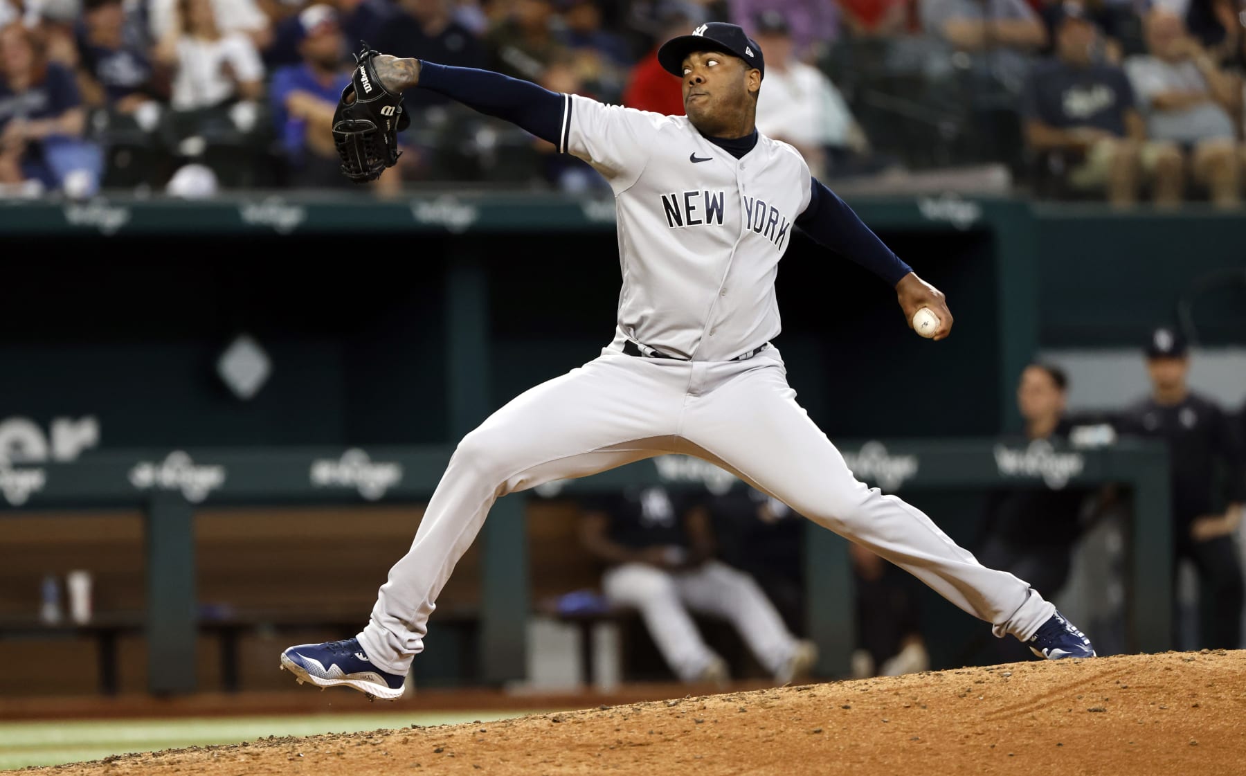 ARLINGTON, TX - OCTOBER 4: Aroldis Chapman #54 of the New York Yankees pitches against the Texas Rangers during the seventh inning in game one of a double header at Globe Life Field on October 4, 2022 in Arlington, Texas. (Photo by Ron Jenkins/Getty Images)
