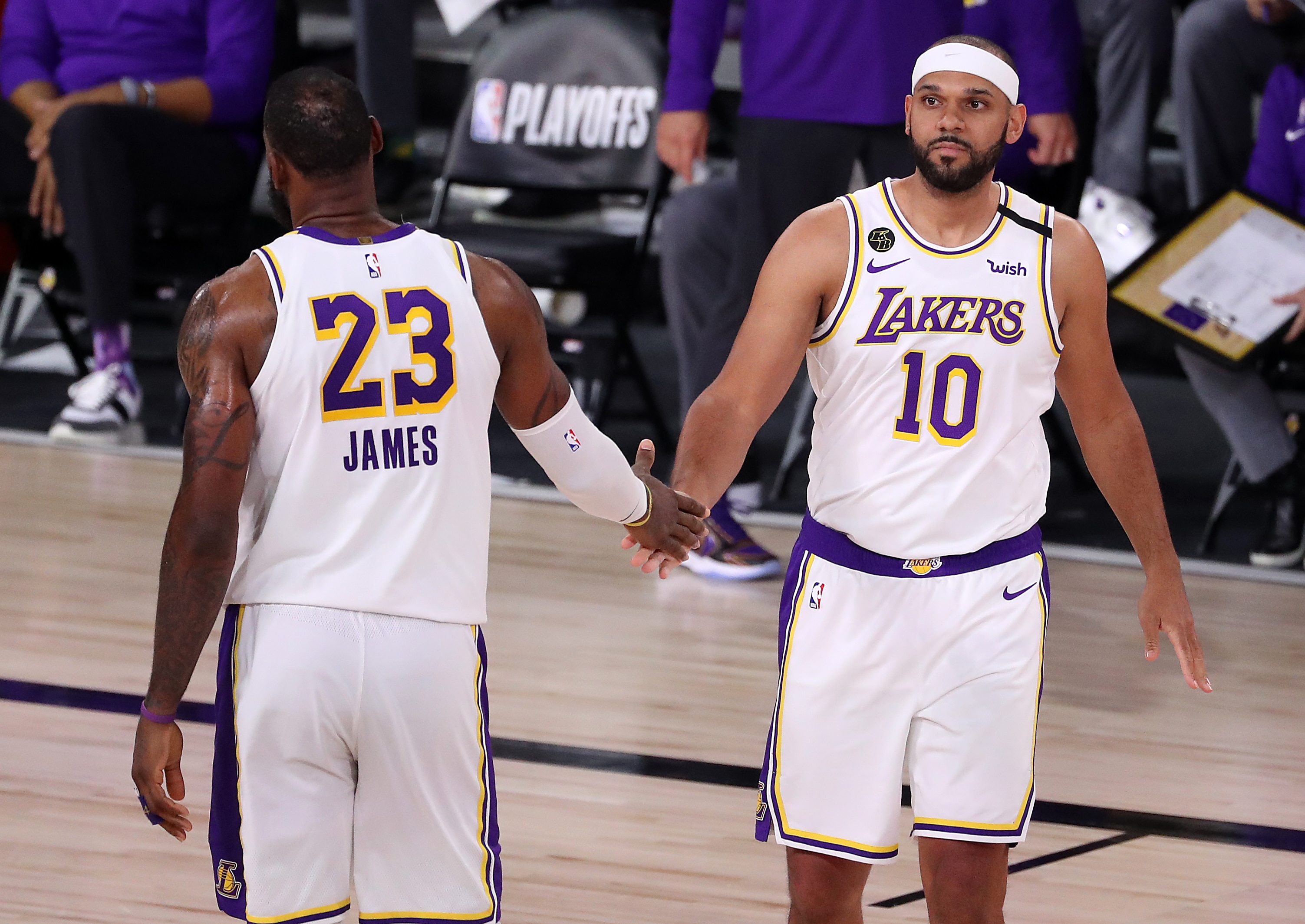 LAKE BUENA VISTA, FLORIDA - SEPTEMBER 12: LeBron James #23 of the Los Angeles Lakers high fives Jared Dudley #10 of the Los Angeles Lakers during the fourth quarter in Game Five of the Western Conference Second Round during the 2020 NBA Playoffs at AdventHealth Arena at the ESPN Wide World Of Sports Complex on September 12, 2020 in Lake Buena Vista, Florida. NOTE TO USER: User expressly acknowledges and agrees that, by downloading and or using this photograph, User is consenting to the terms and conditions of the Getty Images License Agreement. (Photo by Michael Reaves/Getty Images)