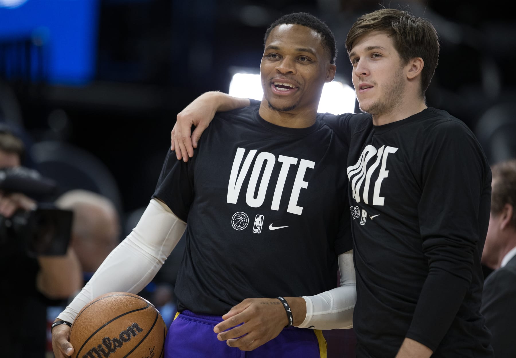SALT LAKE CITY UT- NOVEMBER 7:  Russell Westbrook #0 of the Los Angeles Lakers wears a Vote tshirt and laughs with teammate Austin Reaves #15 during warmups before their game against the Utah Jazz at the Vivint Arena November 7, 2022 in Salt Lake City Utah. NOTE TO USER: User expressly acknowledges and agrees that, by downloading and using this photograph, User is consenting to the terms and conditions of the Getty Images License Agreement (Photo by Chris Gardner/ Getty Images)