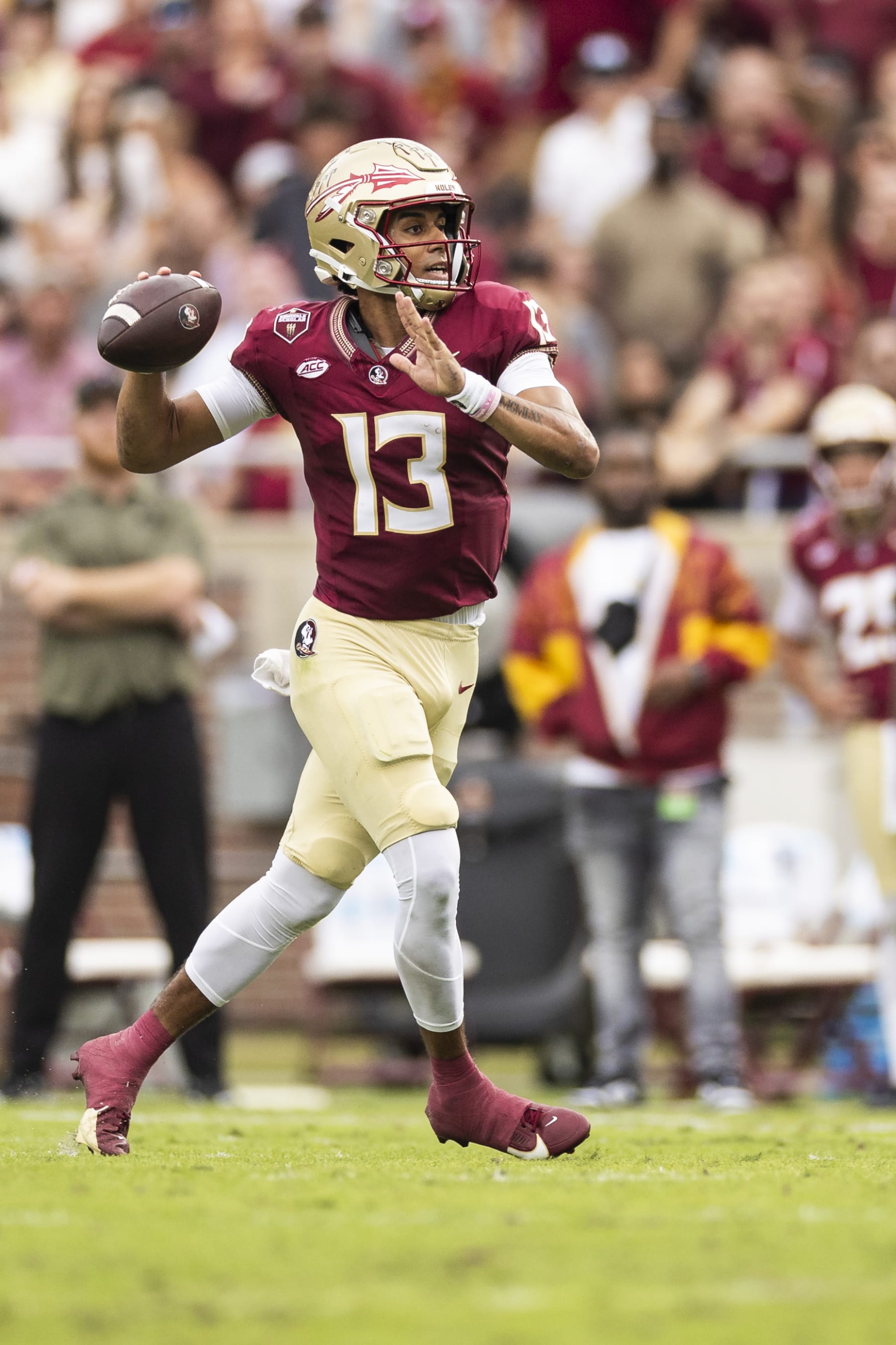 TALLAHASSEE, FLORIDA - NOVEMBER 11: Jordan Travis #13 of the Florida State Seminoles throws a pass during the first half of a game against the Miami Hurricanes at Doak Campbell Stadium on November 11, 2023 in Tallahassee, Florida. (Photo by James Gilbert/Getty Images)