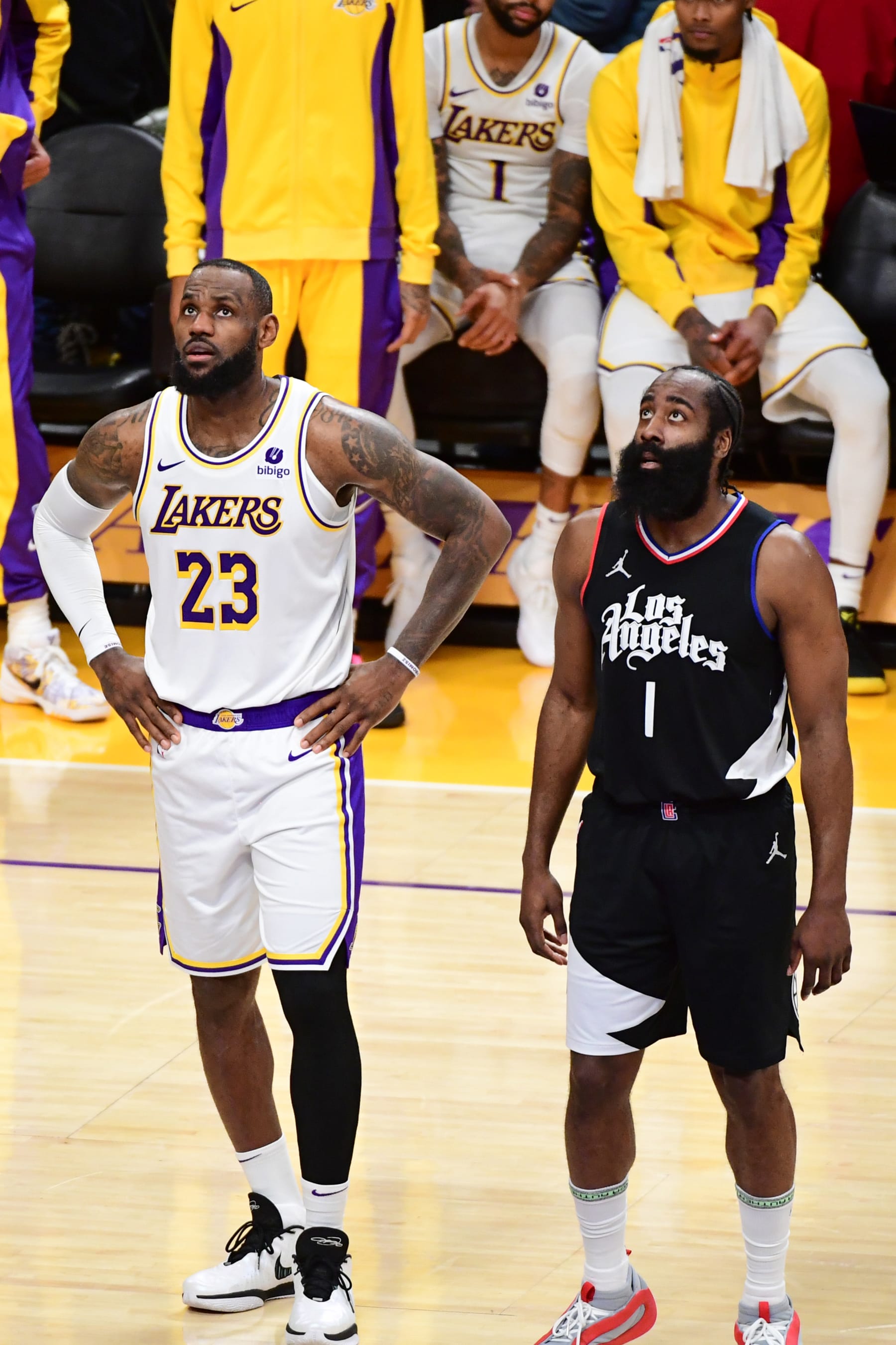 LOS ANGELES, CA - JANUARY 7:  LeBron James #23 of the Los Angeles Lakers & James Harden #1 of the LA Clippers look on during the game on January 7, 2024 at Crypto.Com Arena in Los Angeles, California. NOTE TO USER: User expressly acknowledges and agrees that, by downloading and/or using this Photograph, user is consenting to the terms and conditions of the Getty Images License Agreement. Mandatory Copyright Notice: Copyright 2024 NBAE (Photo by Adam Pantozzi/NBAE via Getty Images)