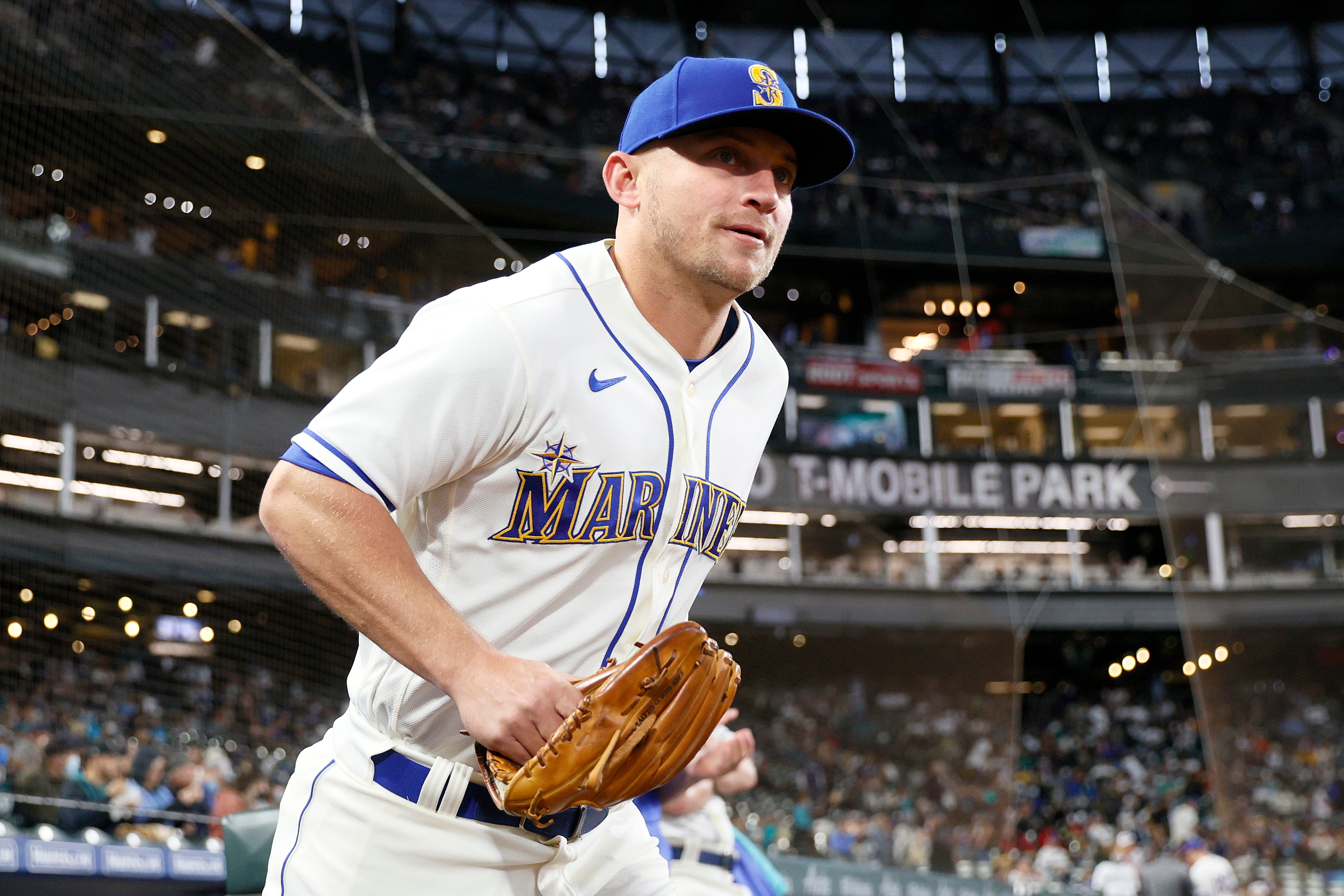 SEATTLE, WASHINGTON - OCTOBER 03: Kyle Seager #15 of the Seattle Mariners runs onto the field before the game against the Los Angeles Angels at T-Mobile Park on October 03, 2021 in Seattle, Washington. (Photo by Steph Chambers/Getty Images)