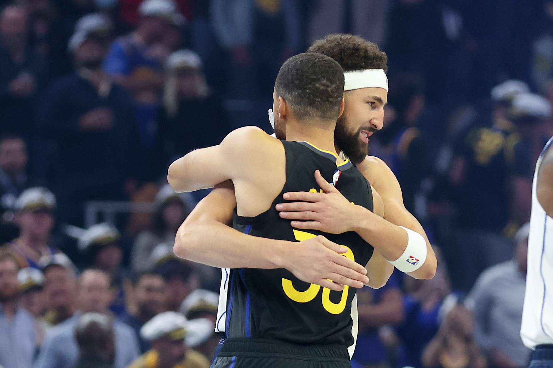SAN FRANCISCO, CALIFORNIA - NOVEMBER 12: Klay Thompson #31 of the Dallas Mavericks hugs former teammate Stephen Curry #30 of the Golden State Warriors before their game at Chase Center on November 12, 2024 in San Francisco, California. This is Thompson's first game back in Golden State after he was traded to Dallas after last season. NOTE TO USER: User expressly acknowledges and agrees that, by downloading and/or using this photograph, user is consenting to the terms and conditions of the Getty Images License Agreement.  (Photo by Ezra Shaw/Getty Images)