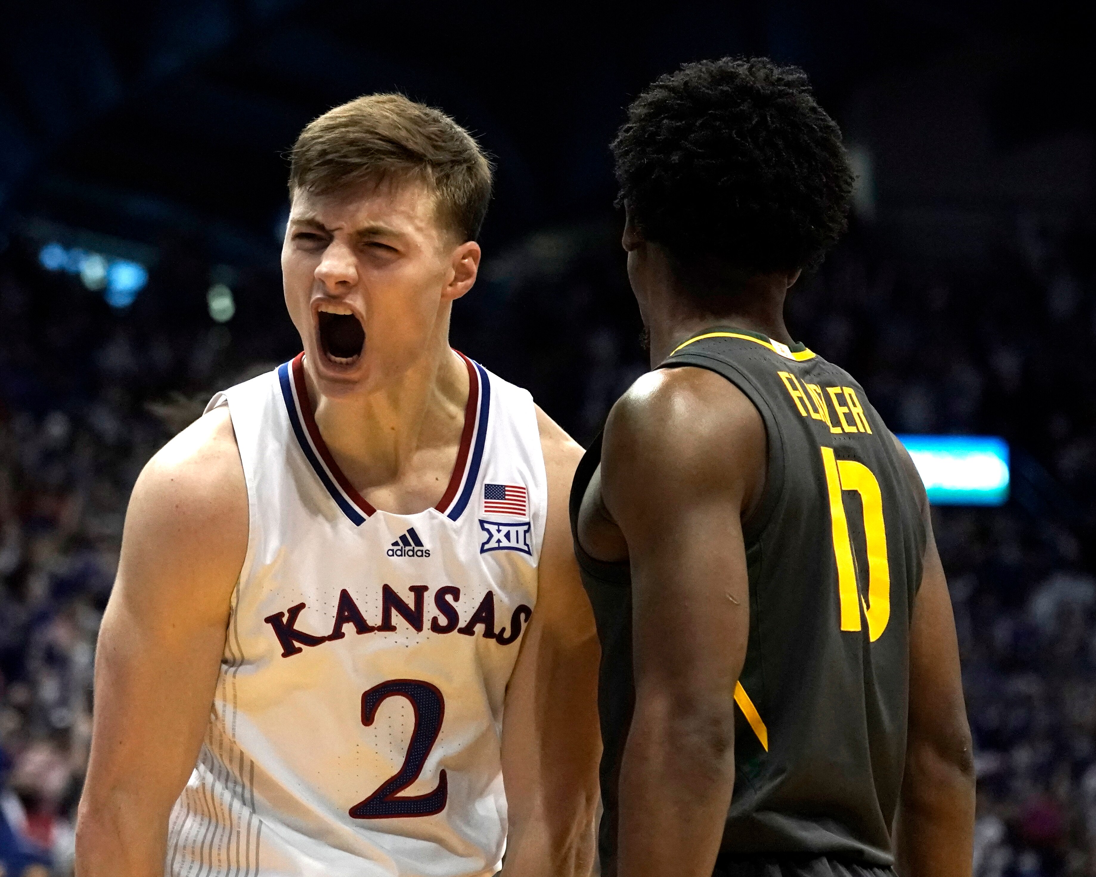 Kansas guard Christian Braun (2) celebrates after a shot during the first half of an NCAA college basketball game against Baylor Saturday, Feb. 5, 2022, in Lawrence, Kan. (AP Photo/Charlie Riedel)