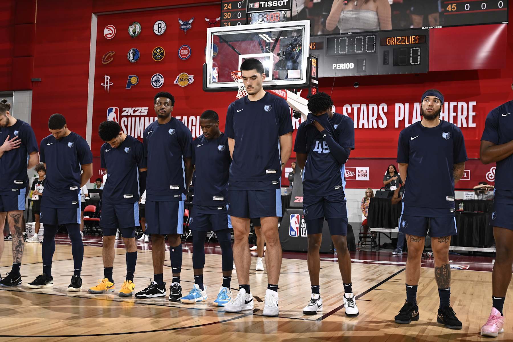 LAS VEGAS, NV - JULY 18: Zach Edey #14 of the Memphis Grizzlies stands for the National Anthem before the game against the New Orleans Pelicans on July 18, 2024 at the Cox Pavilion in Las Vegas, Nevada. NOTE TO USER: User expressly acknowledges and agrees that, by downloading and or using this photograph, User is consenting to the terms and conditions of the Getty Images License Agreement. Mandatory Copyright Notice: Copyright 2024 NBAE (Photo by David Dow/NBAE via Getty Images)