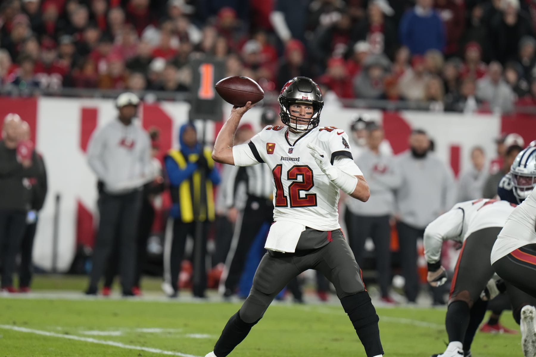 Tampa Bay Buccaneers quarterback Tom Brady (12) works in the pocket against the Dallas Cowboys during the first half of an NFL wild-card football game, Monday, Jan. 16, 2023, in Tampa, Fla. (AP Photo/Chris O'Meara)