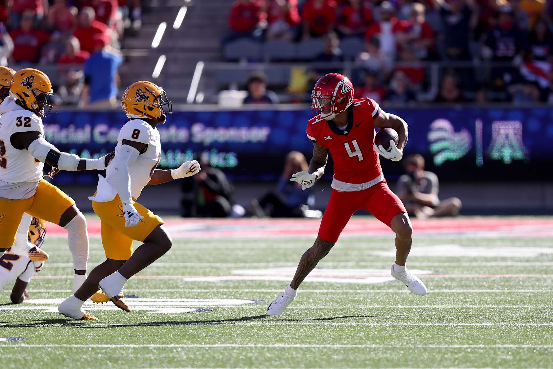 TUCSON, AZ - NOVEMBER 30: Arizona Wildcats wide receiver Tetairoa McMillan #4 during the first half of a football game between the Arizona State University Sun Devils and the University of Arizona Wildcats.  November 30, 2024 at Arizona Stadium in Tucson, AZ. (Photo by Christopher Hook/Icon Sportswire via Getty Images)