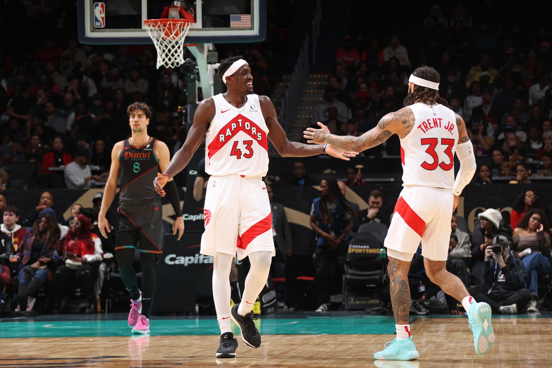 WASHINGTON, DC -  DECEMBER 27: Pascal Siakam #43 and Gary Trent Jr. #33 of the Toronto Raptors high five during the game against the Washington Wizards on December 27, 2023 at Capital One Arena in Washington, DC. NOTE TO USER: User expressly acknowledges and agrees that, by downloading and or using this Photograph, user is consenting to the terms and conditions of the Getty Images License Agreement. Mandatory Copyright Notice: Copyright 2023 NBAE (Photo by Stephen Gosling/NBAE via Getty Images)