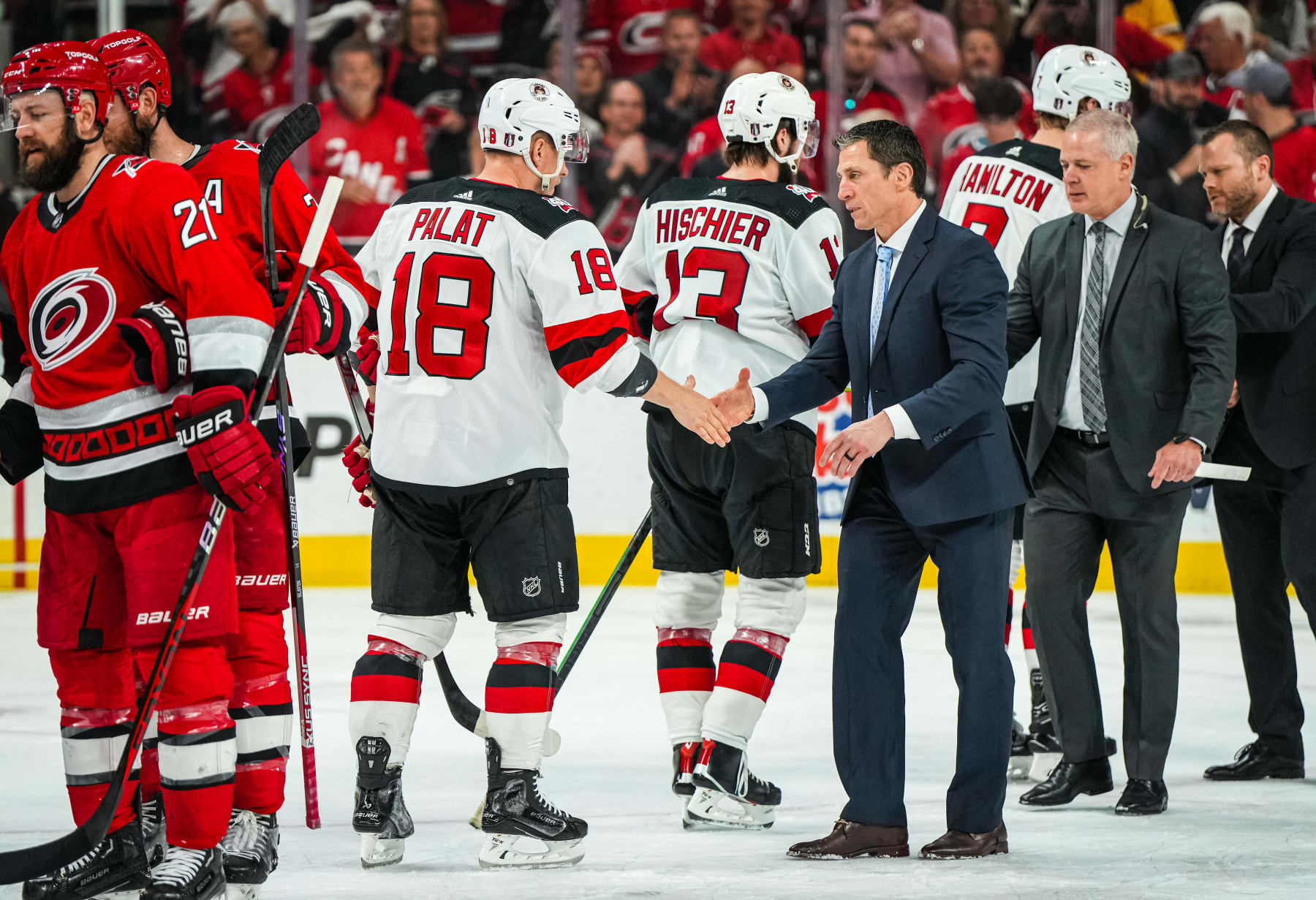 RALEIGH, NORTH CAROLINA - MAY 11: The Carolina Hurricanes and the New Jersey Devils shake hands after Game Five of the Second Round of the 2023 Stanley Cup Playoffs at PNC Arena on May 11, 2023 in Raleigh, North Carolina. (Photo by Josh Lavallee/NHLI via Getty Images)