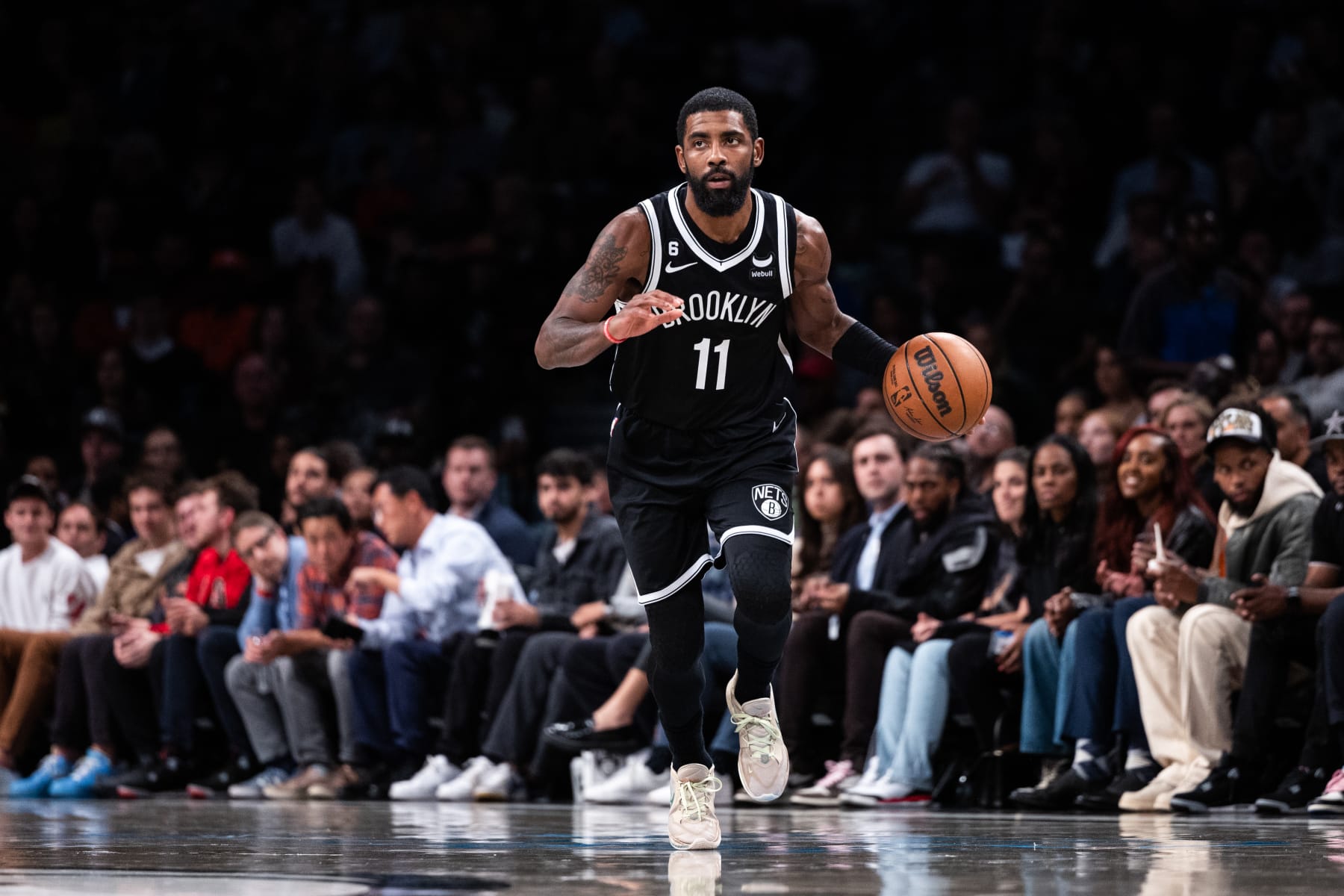 NEW YORK, NEW YORK - NOVEMBER 01: Kyrie Irving #11 of the Brooklyn Nets brings the ball up the court during the third quarter of the game against the Chicago Bulls at Barclays Center on November 01, 2022 in New York City. NOTE TO USER: User expressly acknowledges and agrees that, by downloading and or using this photograph, User is consenting to the terms and conditions of the Getty Images License Agreement. (Photo by Dustin Satloff/Getty Images)