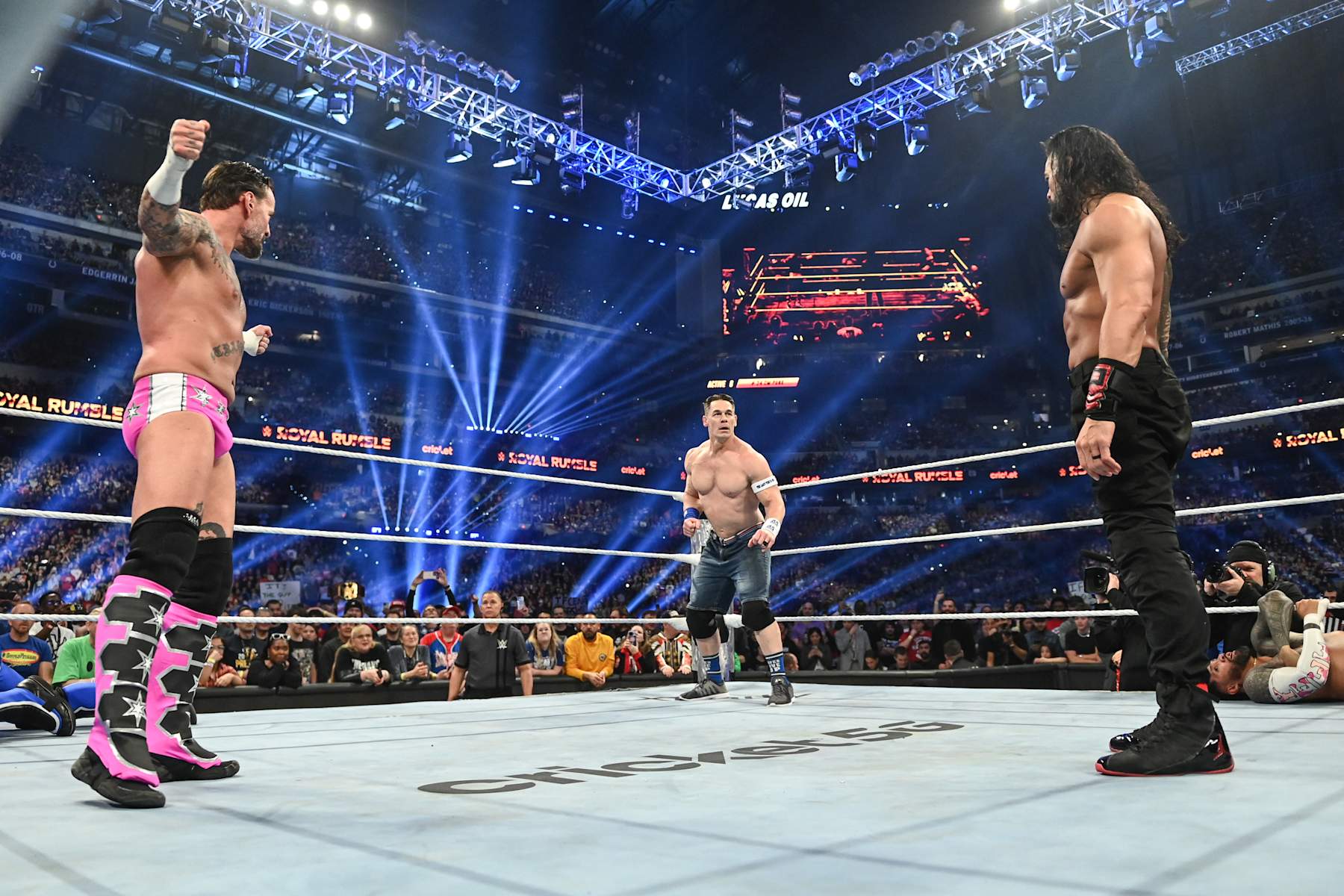 INDIANAPOLIS, INDIANA - FEBRUARY 1: CM Punk, John Cena, and Roman Reigns face off during Royal Rumble at Lucas Oil Stadium on February 1, 2025 in Indianapolis, Indiana. (Photo by Andrew Timms/WWE via Getty Images)