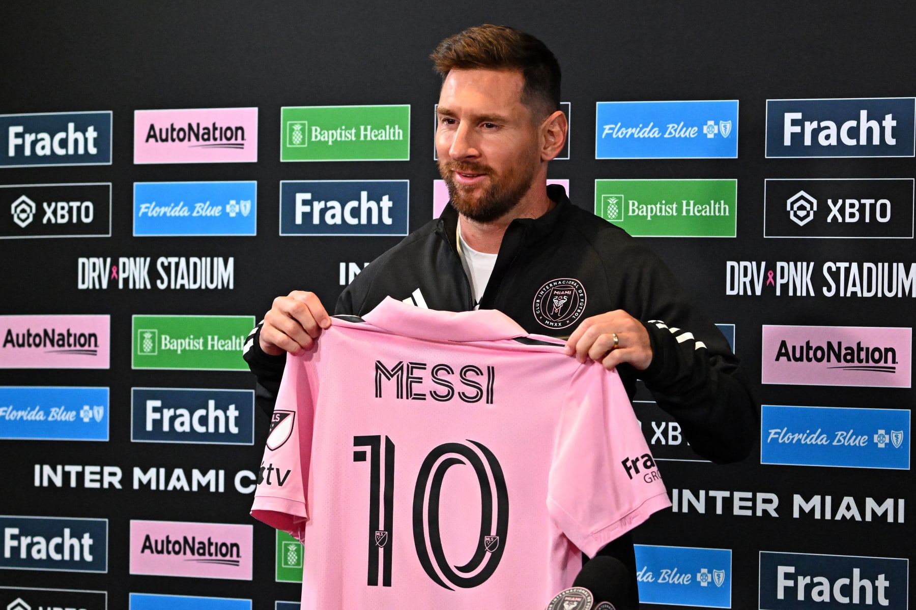 Inter Miami's Argentine forward Lionel Messi holds his jersey during a press conference at DRV PNK Stadium in Fort Lauderdale, Florida on August 17, 2023. (Photo by CHANDAN KHANNA / AFP) (Photo by CHANDAN KHANNA/AFP via Getty Images)