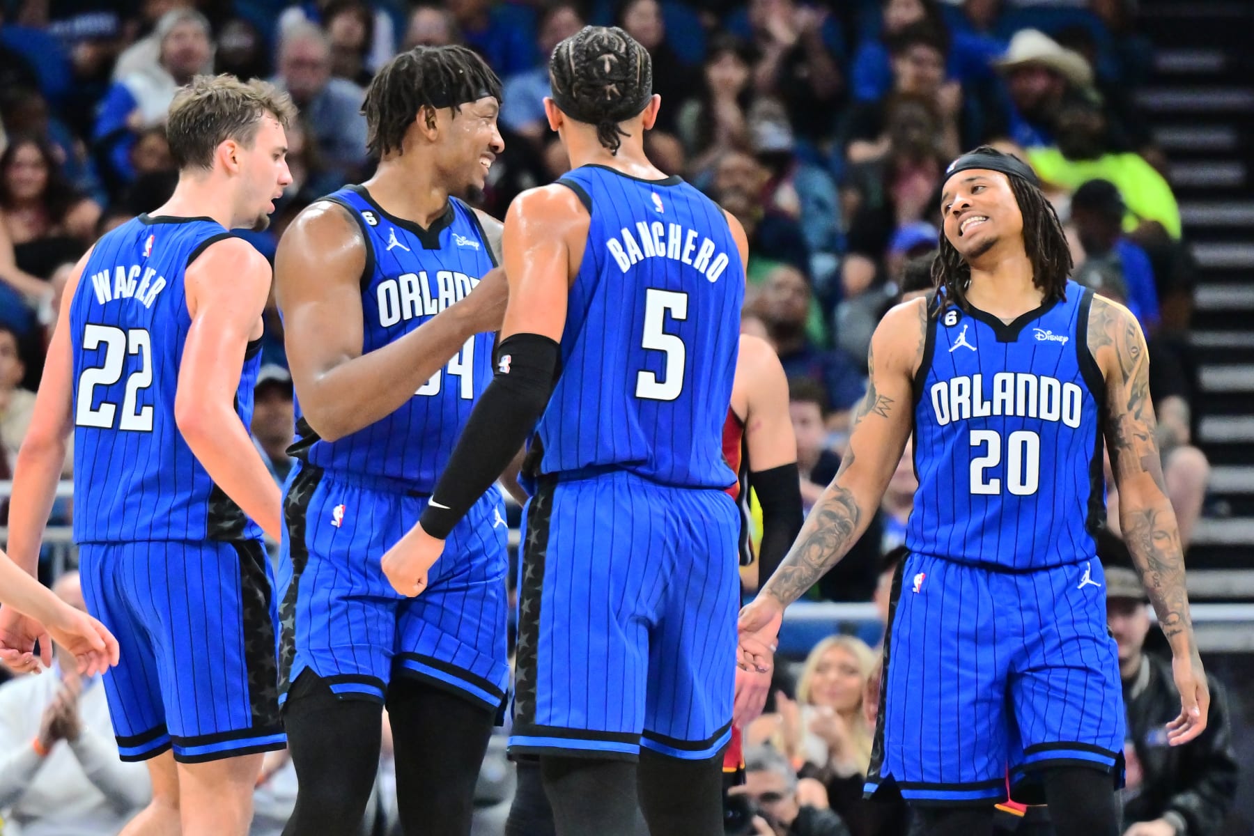 ORLANDO, FLORIDA - MARCH 11: (Left to right) Franz Wagner #22, Wendell Carter Jr. #34, Paolo Banchero #5, and Markelle Fultz #20 of the Orlando Magic react during the first half of a game against the Miami Heat at Amway Center on March 11, 2023 in Orlando, Florida. NOTE TO USER: User expressly acknowledges and agrees that, by downloading and or using this photograph, User is consenting to the terms and conditions of the Getty Images License Agreement. (Photo by Julio Aguilar/Getty Images)
