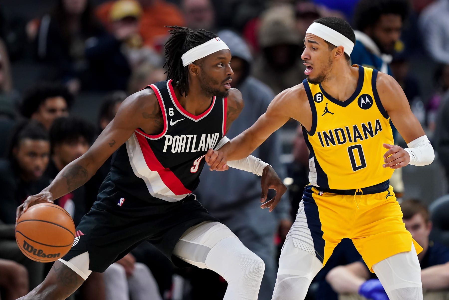 INDIANAPOLIS, INDIANA - JANUARY 06: Jerami Grant #9 of the Portland Trail Blazers dribbles the ball while being guarded by Tyrese Haliburton #0 of the Indiana Pacers in the third quarter at Gainbridge Fieldhouse on January 06, 2023 in Indianapolis, Indiana. NOTE TO USER: User expressly acknowledges and agrees that, by downloading and or using this photograph, User is consenting to the terms and conditions of the Getty Images License Agreement. (Photo by Dylan Buell/Getty Images)