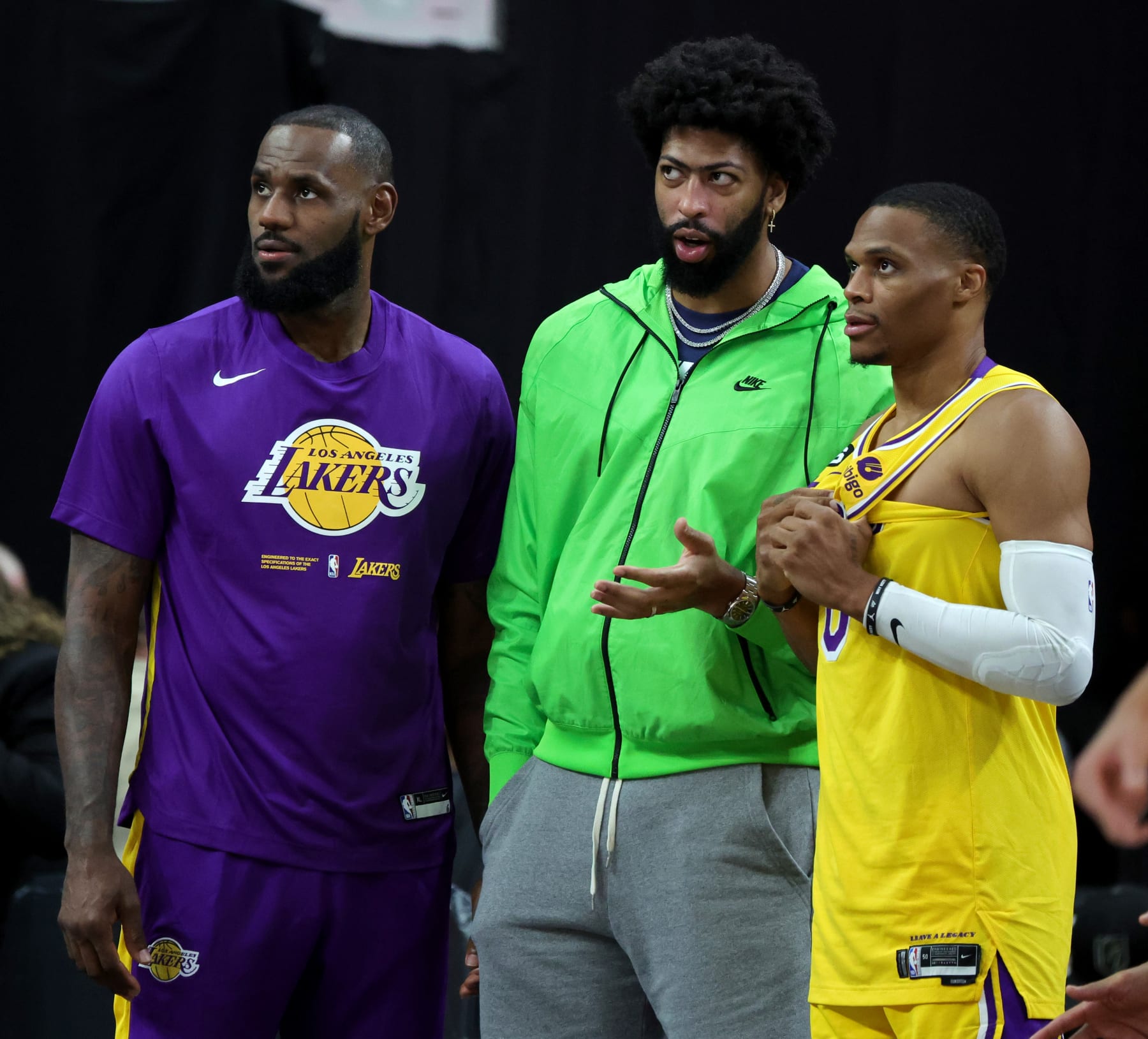 LAS VEGAS, NEVADA - OCTOBER 05: (L-R) LeBron James #6, Anthony Davis #3 and Russell Westbrook #0 of the Los Angeles Lakers look on from the sideline in the fourth quarter of their preseason game against the Phoenix Suns at T-Mobile Arena on October 05, 2022 in Las Vegas, Nevada. The Suns defeated the Lakers 119-115. NOTE TO USER: User expressly acknowledges and agrees that, by downloading and or using this photograph, User is consenting to the terms and conditions of the Getty Images License Agreement. (Photo by Ethan Miller/Getty Images)