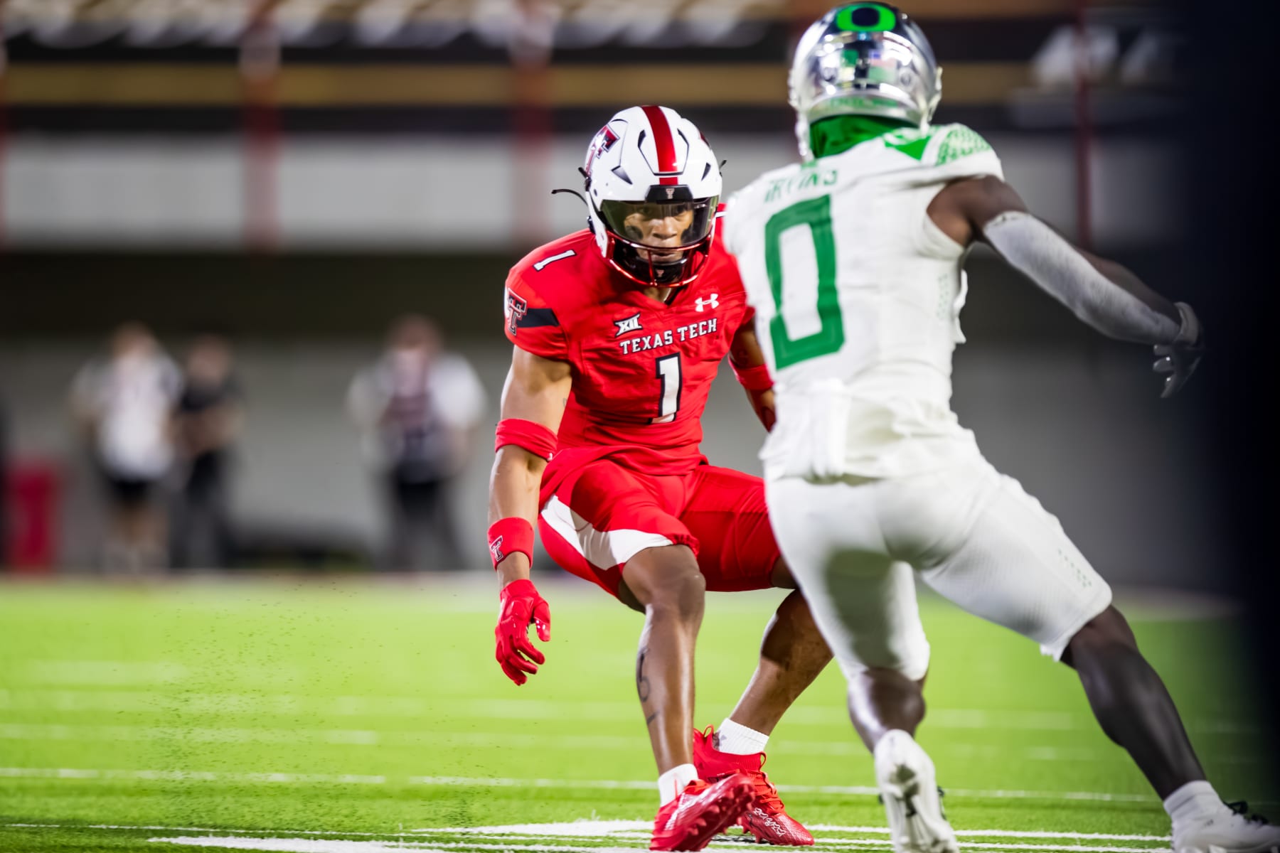 LUBBOCK, TEXAS - SEPTEMBER 09: Dadrion Taylor-Demerson #1 of the Texas Tech Red Raiders defends against Bucky Irving #0 of the Oregon Ducks during the second half of the game at Jones AT&T Stadium on September 09, 2023 in Lubbock, Texas. (Photo by John E. Moore III/Getty Images)