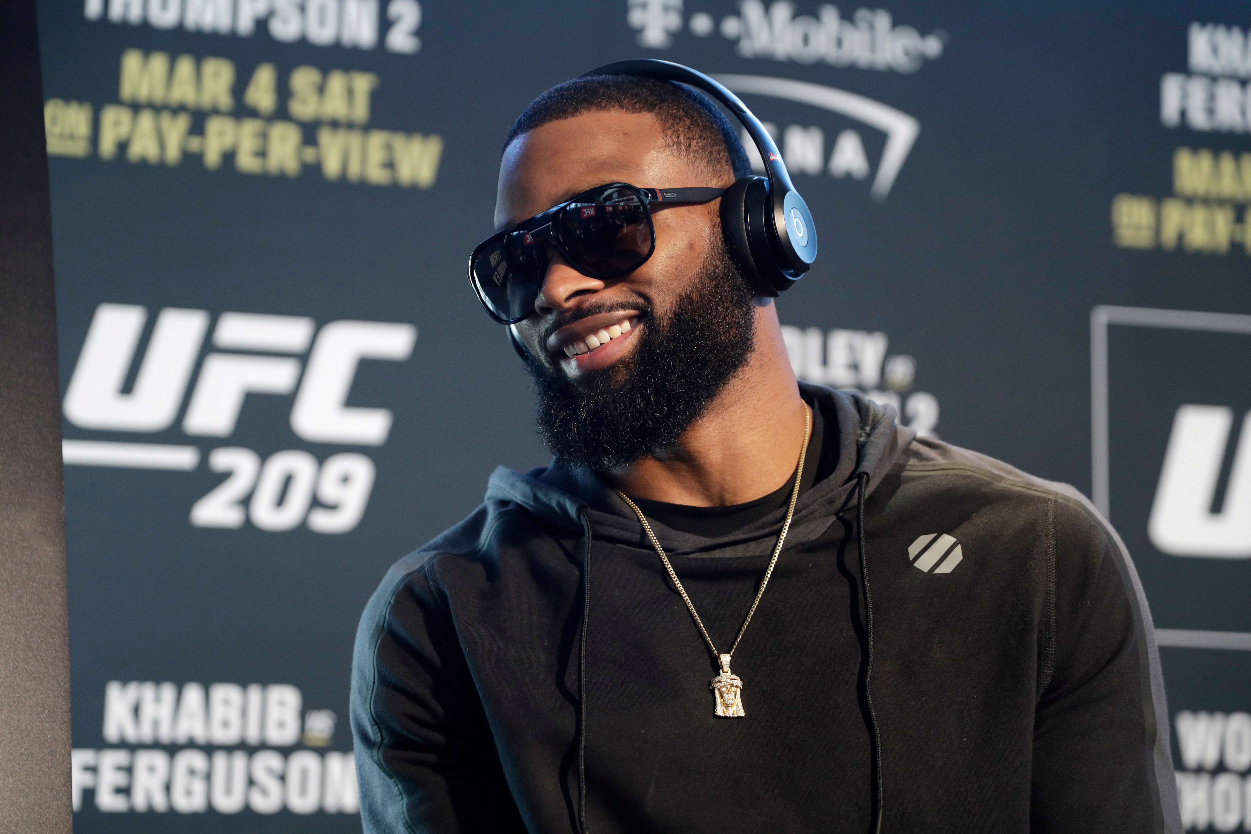 FILE - In this March 2, 2017, file photo, Tyron Woodley speaks with the media during a news conference for UFC 209, in Las Vegas. Woodley is back to defend his welterweight championship for the first time since UFC President Dana White blasted a winning performance last summer, when Woodley said he injured a shoulder during the fight.Since that event in California about 13 months ago, Woodley had surgery and dismissed an event for an interim welterweight title as a bout for a “boo-boo belt.” The 36-year-old didn’t seem as interested in taking on the sanctioning body as he prepared to face undefeated challenger Darren Till at UFC 228 on Saturday night. (AP Photo/John Locher, File)