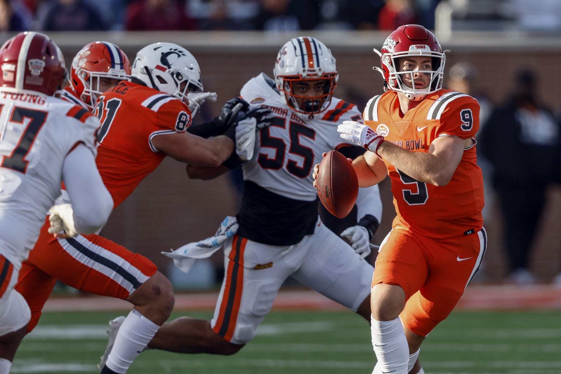 National quarterback Jake Haener of Fresno State (9) rolls out to pass during the second half of the Senior Bowl NCAA college football game, Saturday, Feb. 4, 2023, in Mobile, Ala.. (AP Photo/Butch Dill)