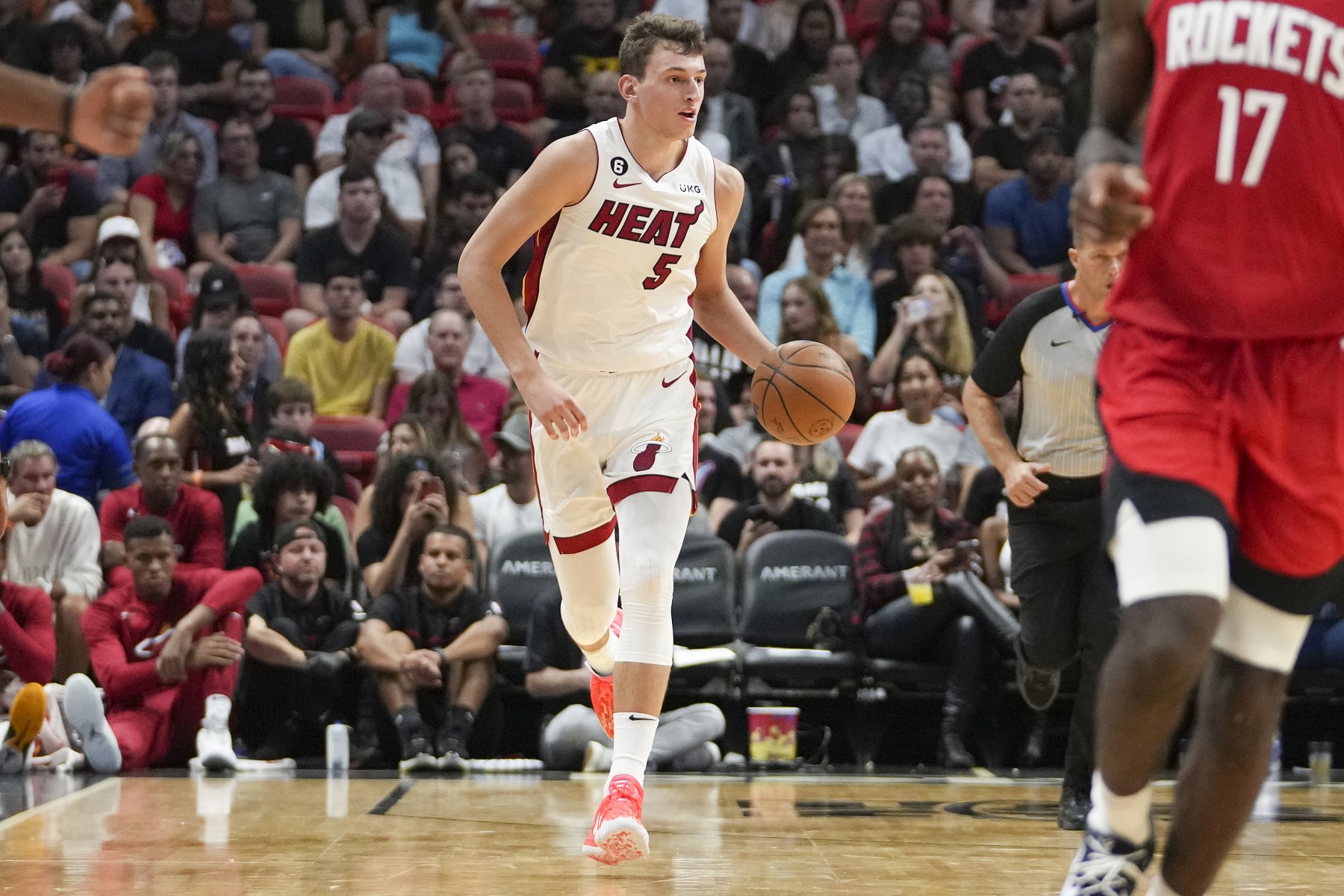 MIAMI, FLORIDA - OCTOBER 10: Nikola Jovic #5 of the Miami Heat brings the basketball upcourt during the second half against the Houston Rockets at FTX Arena on October 10, 2022 in Miami, Florida. NOTE TO USER: User expressly acknowledges and agrees that, by downloading and or using this photograph, User is consenting to terms and conditions of the Getty Images License Agreement. (Photo by Eric Espada/Getty Images)