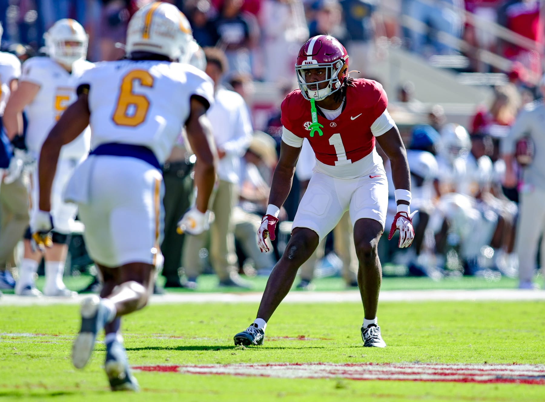 TUSCALOOSA, ALABAMA - NOVEMBER 18: Kool-Aid McKinstry #1 of the Alabama Crimson Tide defends Javin Whatley #6 of the Chattanooga Mocs during the first half at Bryant-Denny Stadium on November 18, 2023 in Tuscaloosa, Alabama. (Photo by Brandon Sumrall/Getty Images)