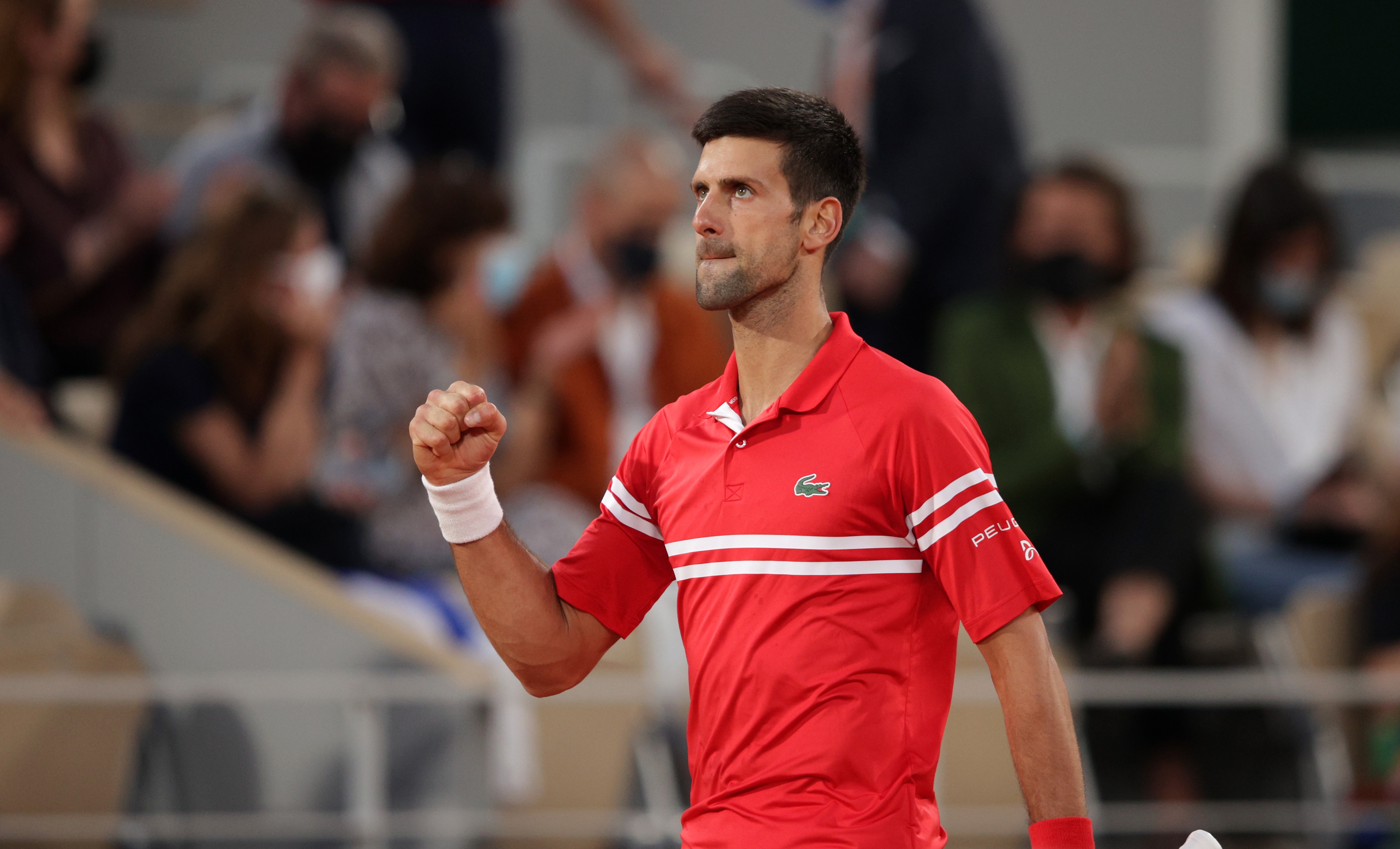 PARIS, FRANCE - JUNE 09: Novak Djokovic of Serbia celebrates a point during his Mens Singles Quarter-Final match against Matteo Berrettini of Italy during Day Eleven of the 2021 French Open at Roland Garros on June 09, 2021 in Paris, France. (Photo by Adam Pretty/Getty Images)