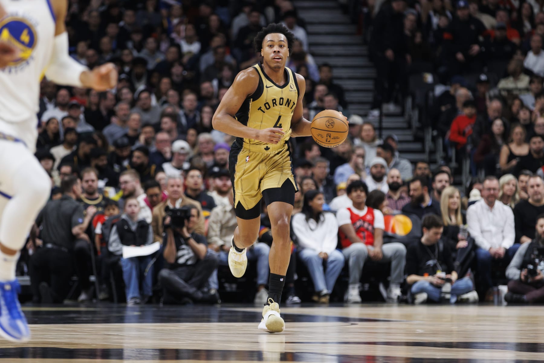 TORONTO, CANADA - MARCH 1: Scottie Barnes#4 of the Toronto Raptors dribbles against the Golden State Warriors during the first half of their NBA game at Scotiabank Arena on March 1, 2024 in Toronto, Canada. NOTE TO USER: User expressly acknowledges and agrees that, by downloading and or using this photograph, User is consenting to the terms and conditions of the Getty Images License Agreement. (Photo by Cole Burston/Getty Images)